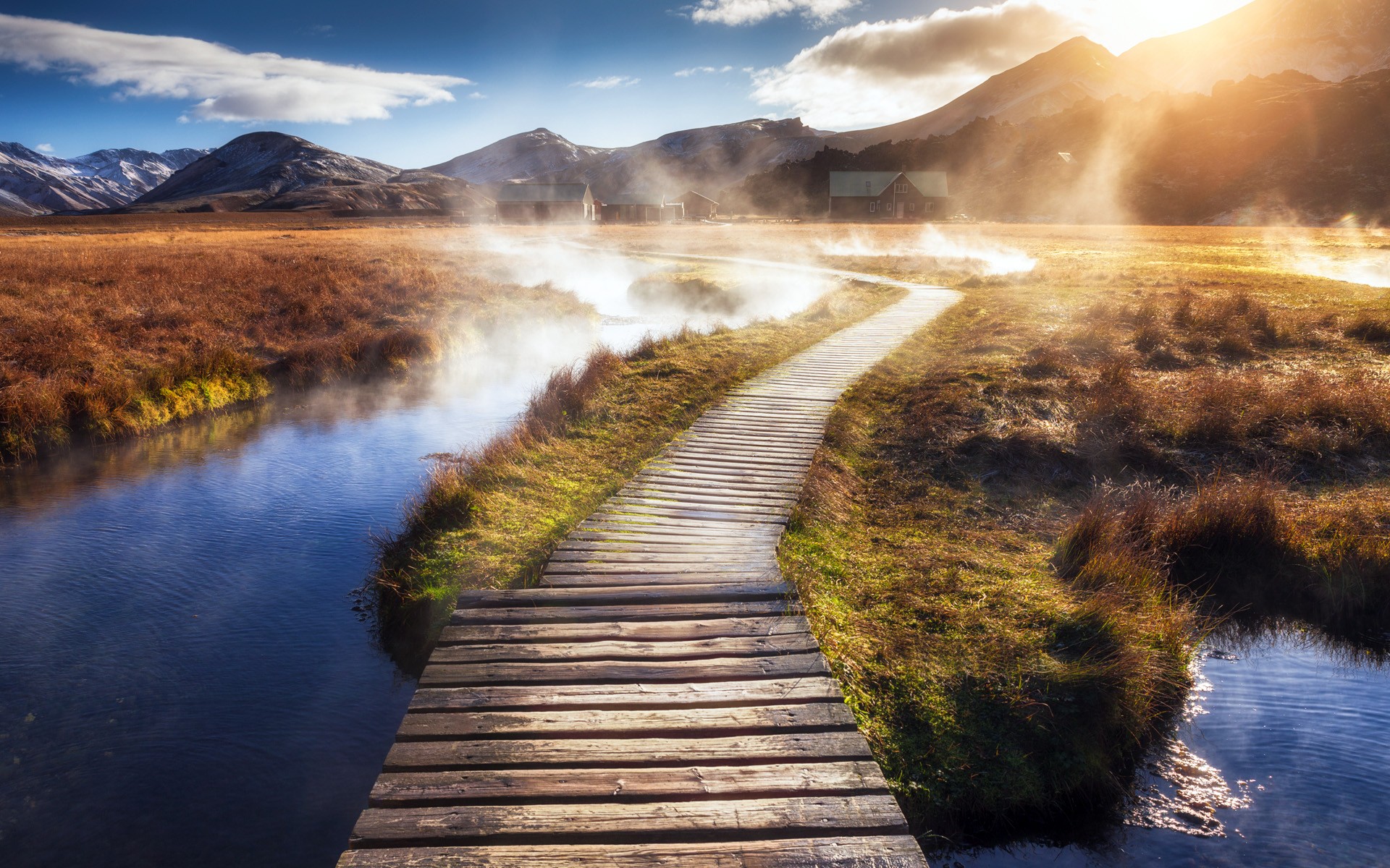 Wooden walkway through a misty landscape with mountains HD Wallpaper