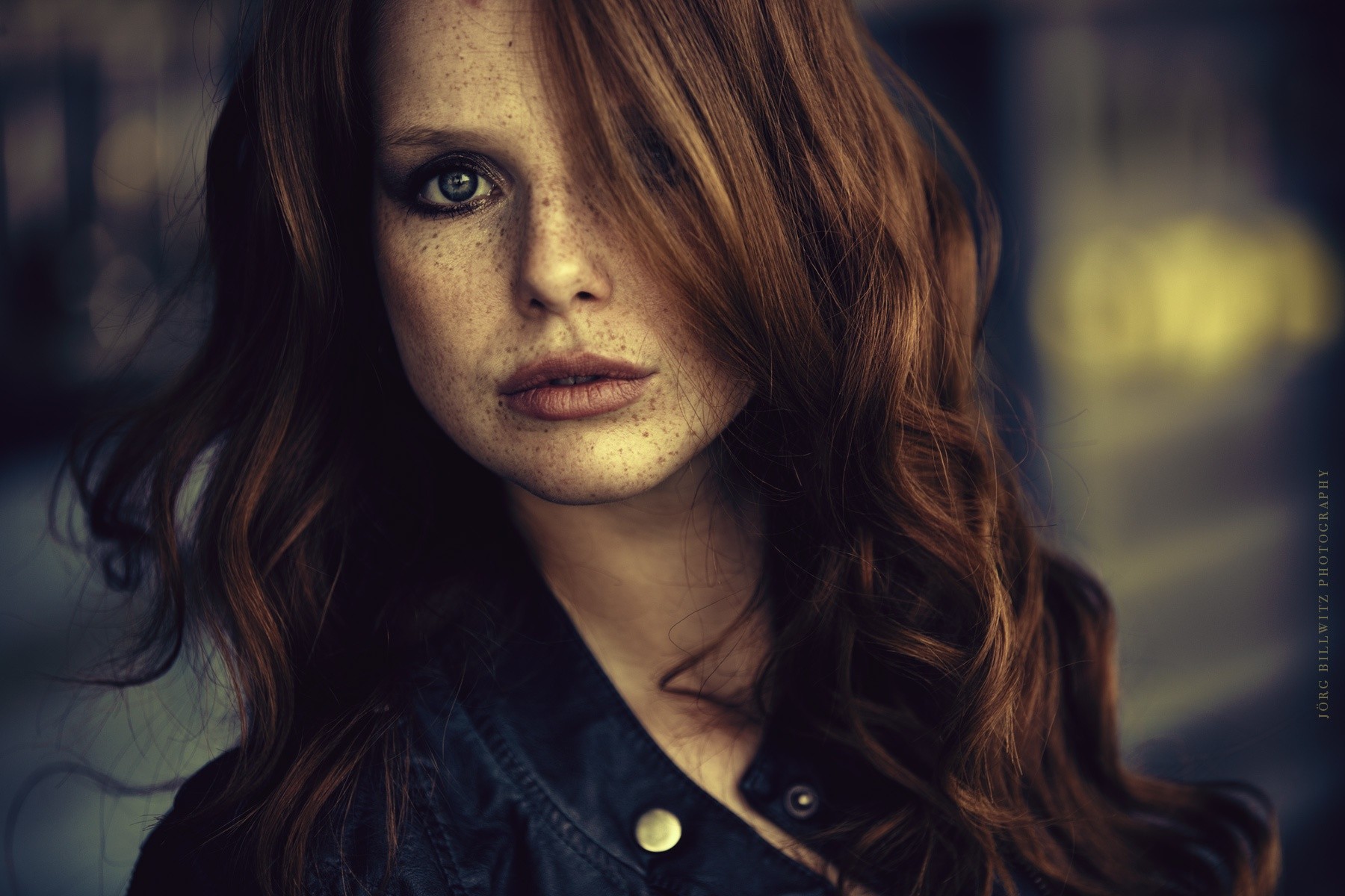 Woman with freckles and smoky eyes HD Wallpaper