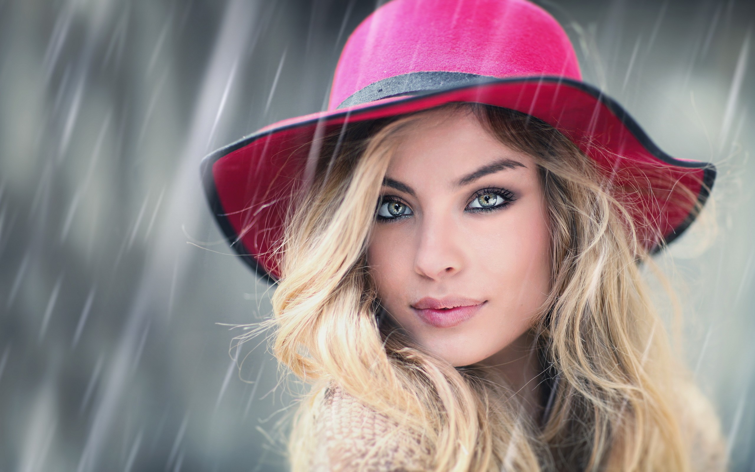 Woman wearing a pink hat in the rain HD Wallpaper