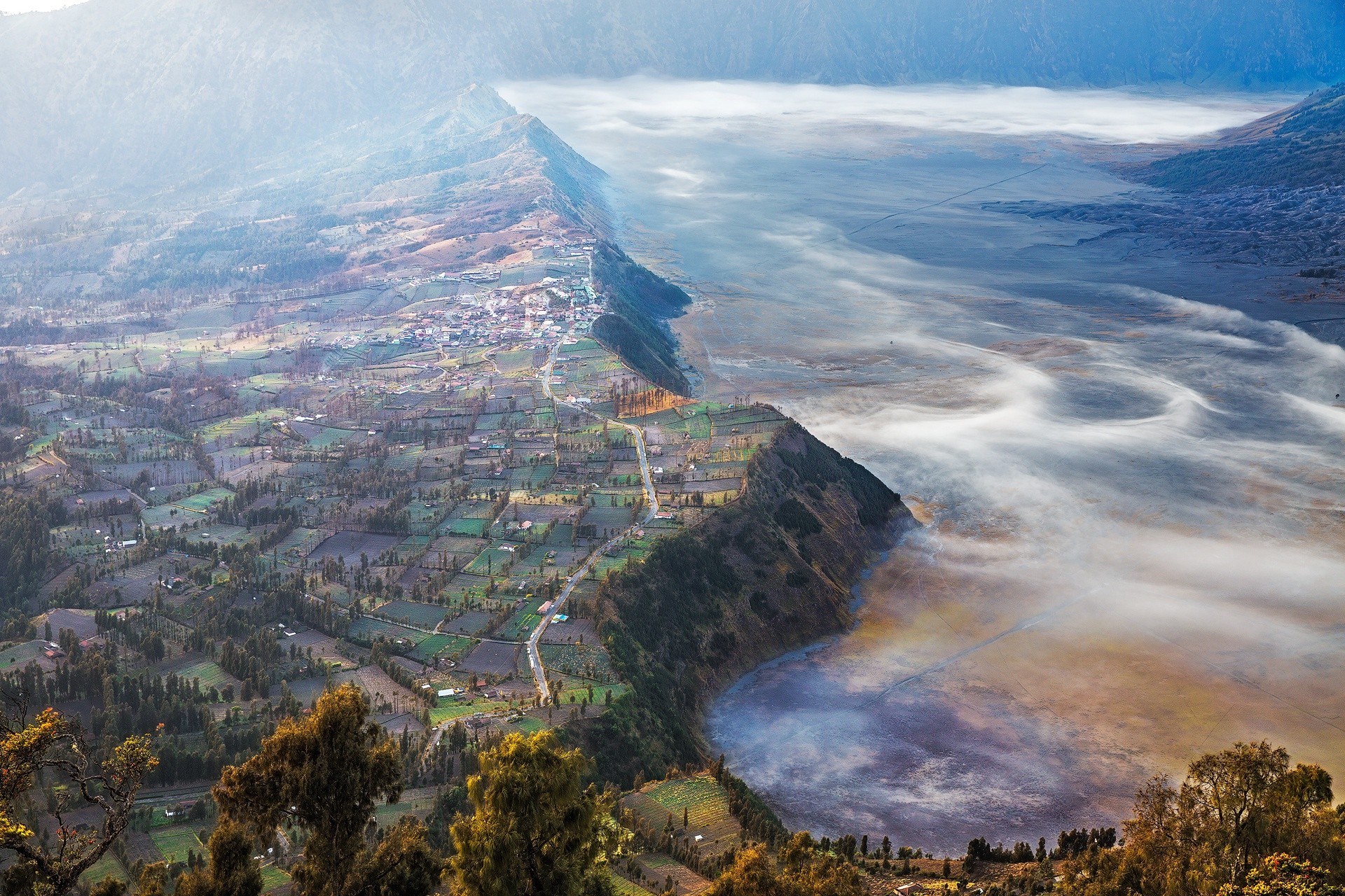 Aerial view of villages and misty valley in Indonesia HD Wallpaper