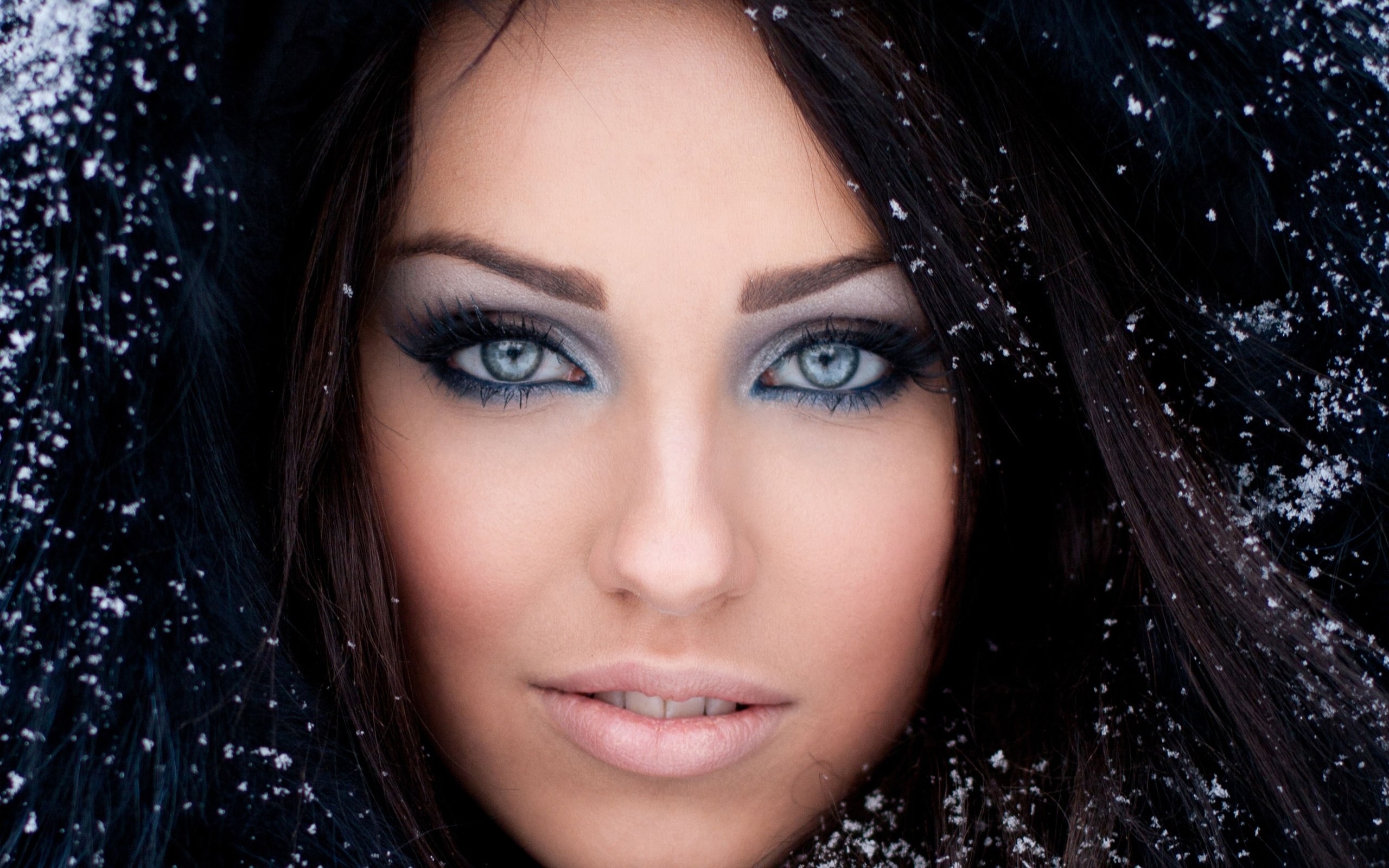 Portrait of a woman with blue eyes and snow HD Wallpaper