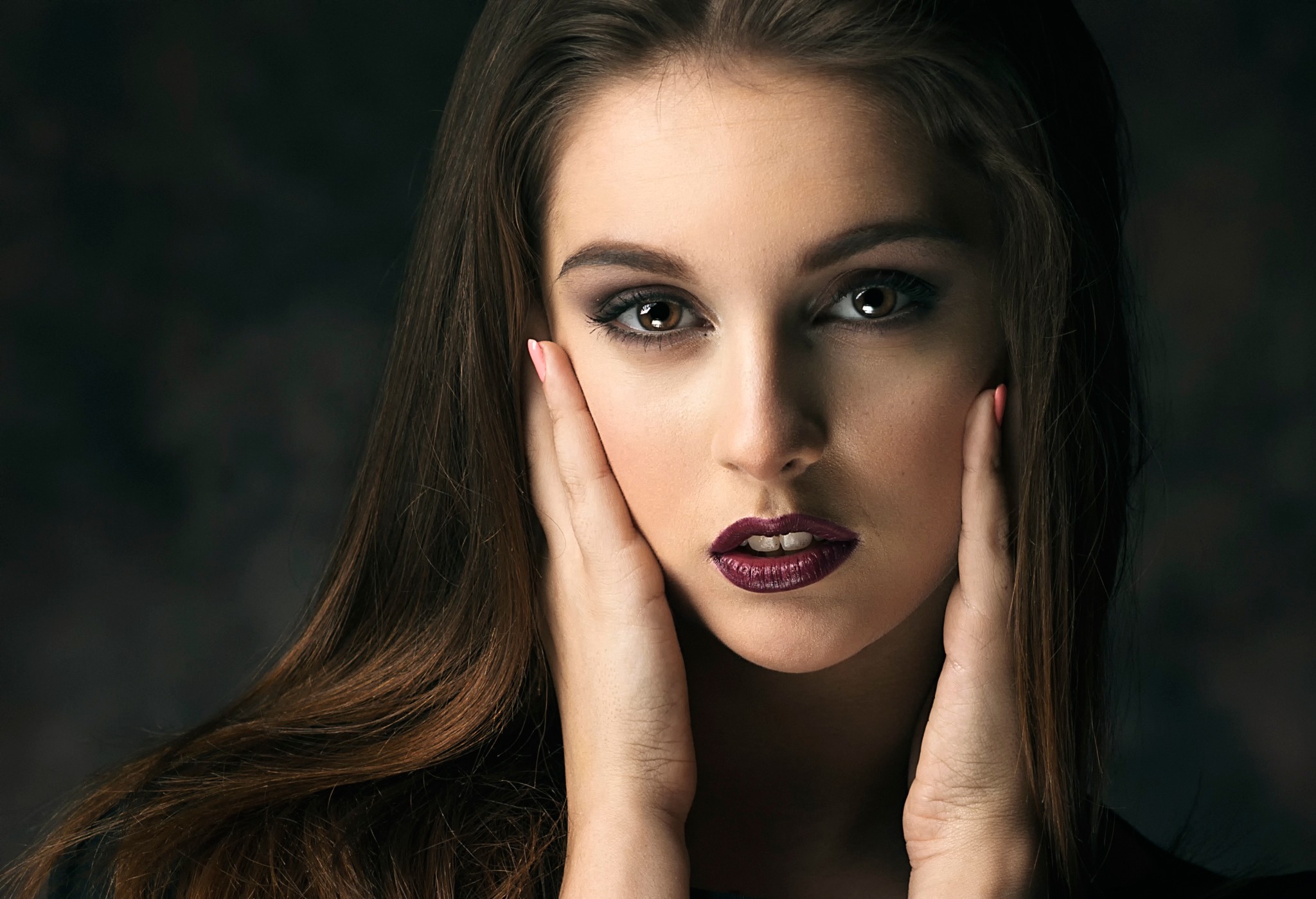 Portrait of a young woman with dark hair and makeup HD Wallpaper