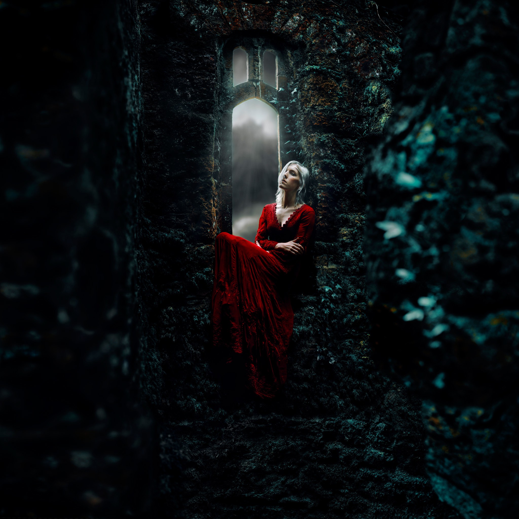 Woman in red dress sitting in a gothic window HD Wallpaper