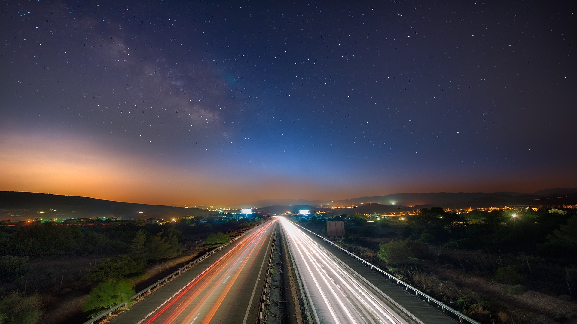 Long exposure of a highway under the Milky Way HD Wallpaper