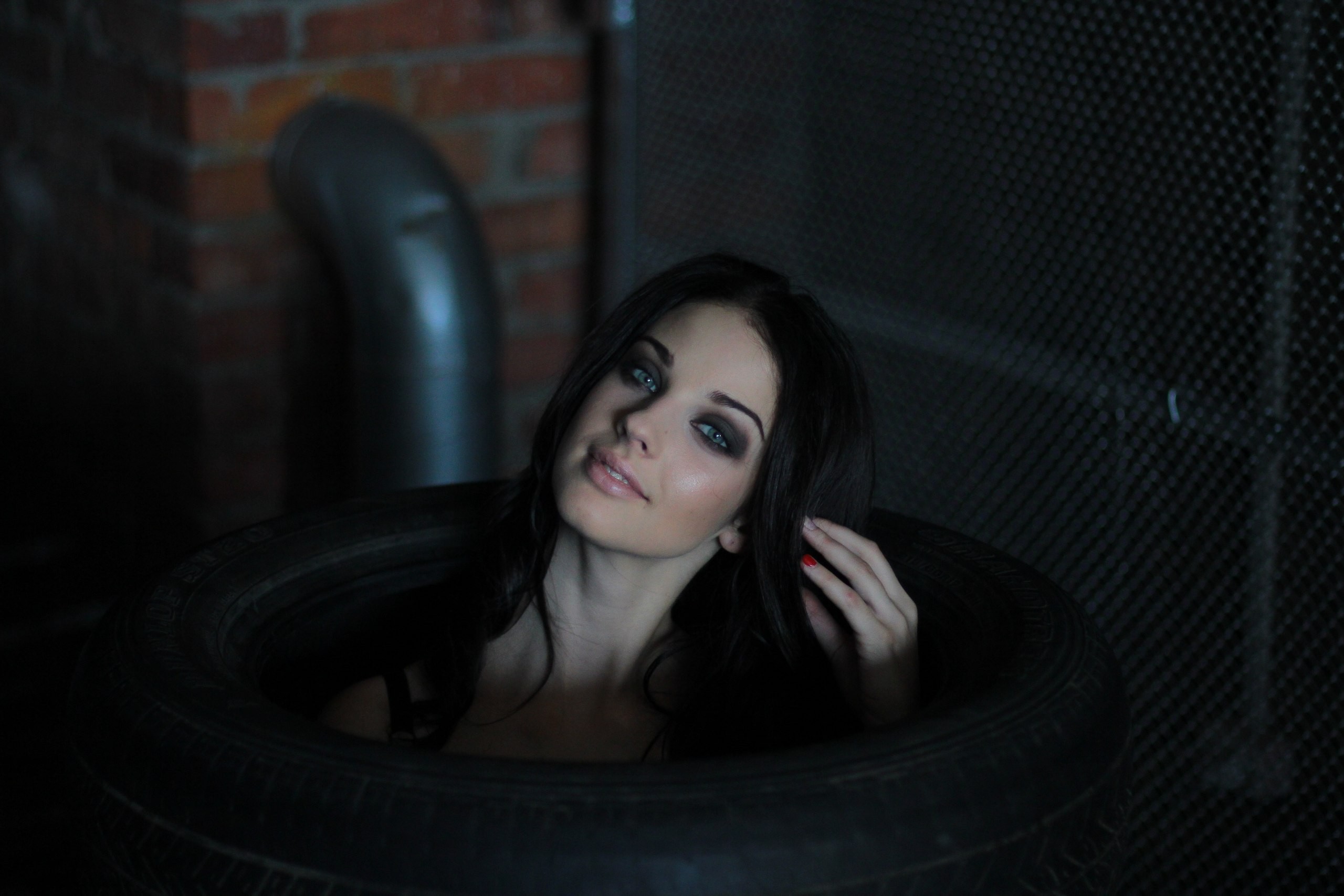 Alla Berger posing in a tire HD Wallpaper