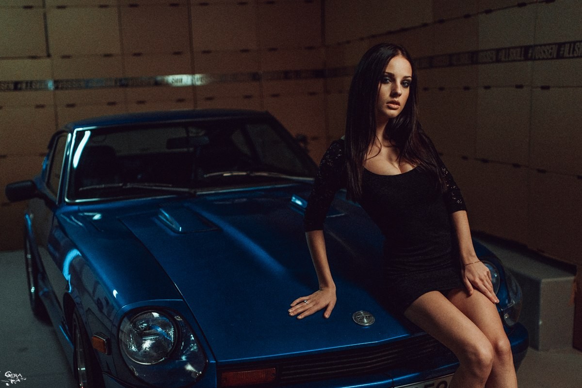 Alla Berger posing with a blue car HD Wallpaper