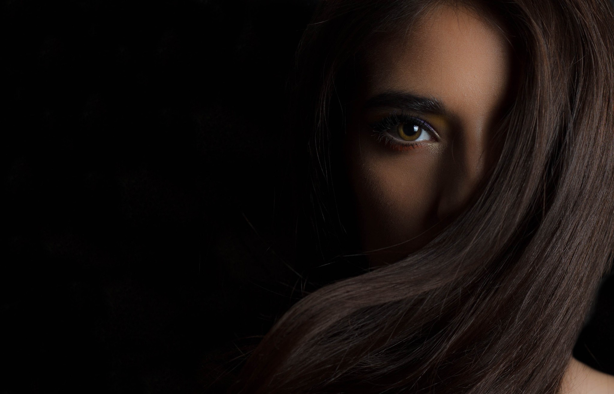 Woman's face partially obscured by hair HD Wallpaper