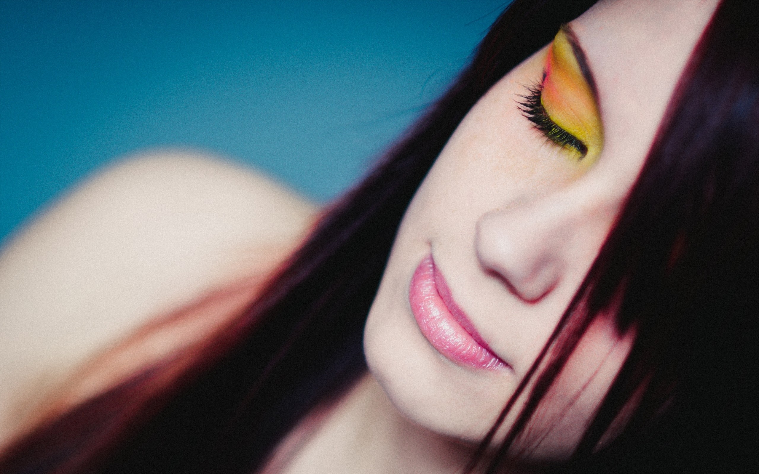 Woman with colorful eyeshadow and black hair HD Wallpaper