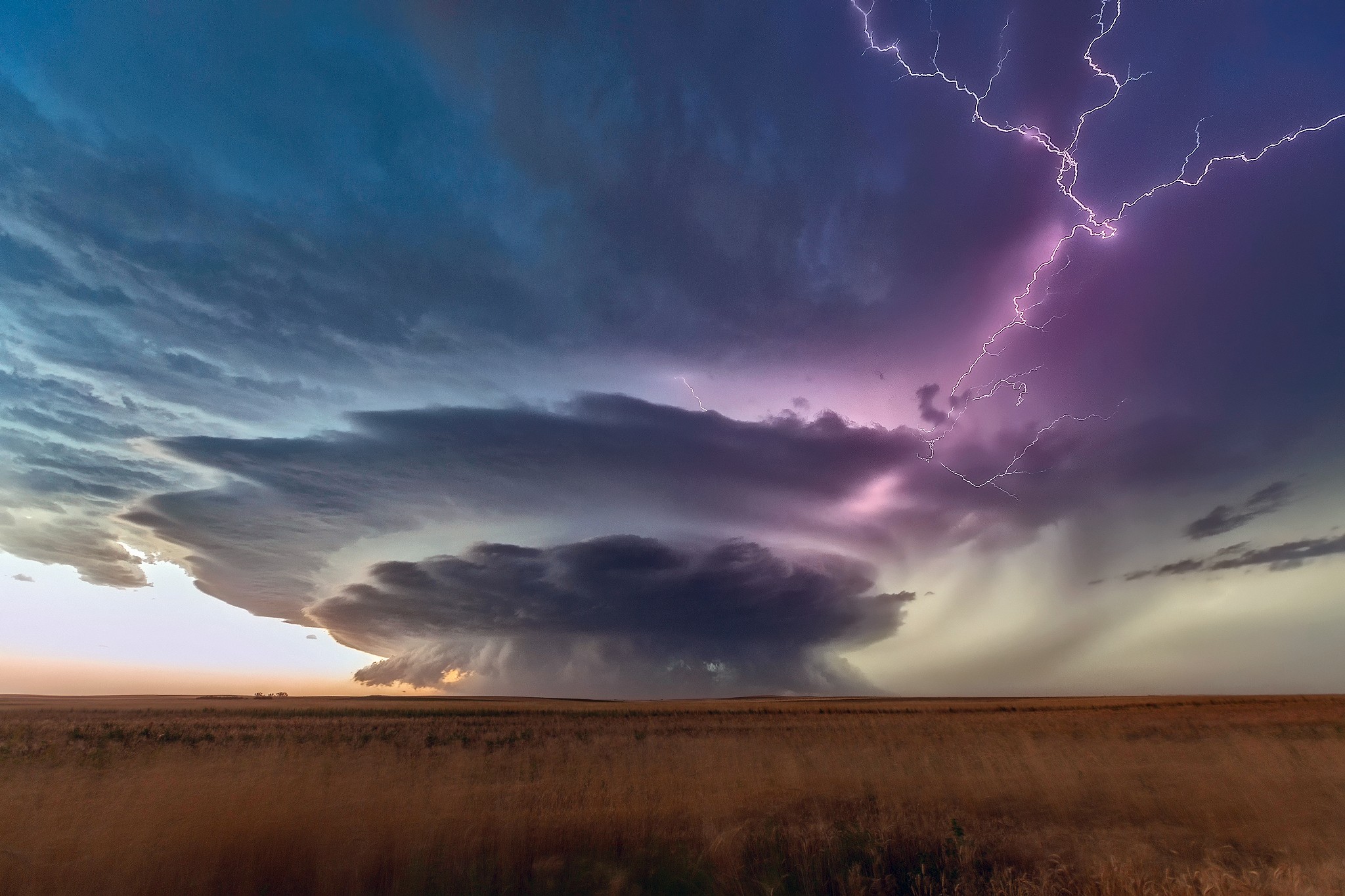 Lightning strikes over a storm cloud in South Dakota plains HD Wallpaper