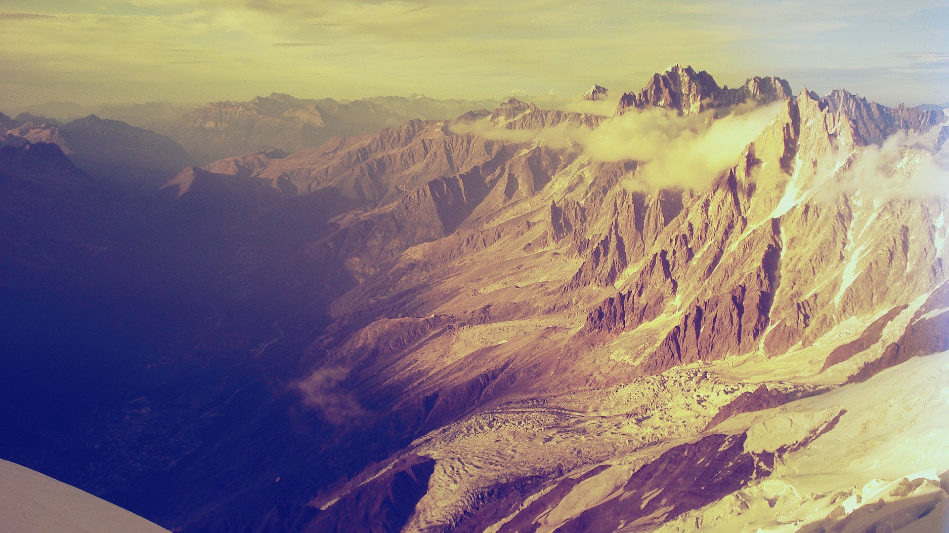Majestic mountain range with clouds and valleys HD Wallpaper
