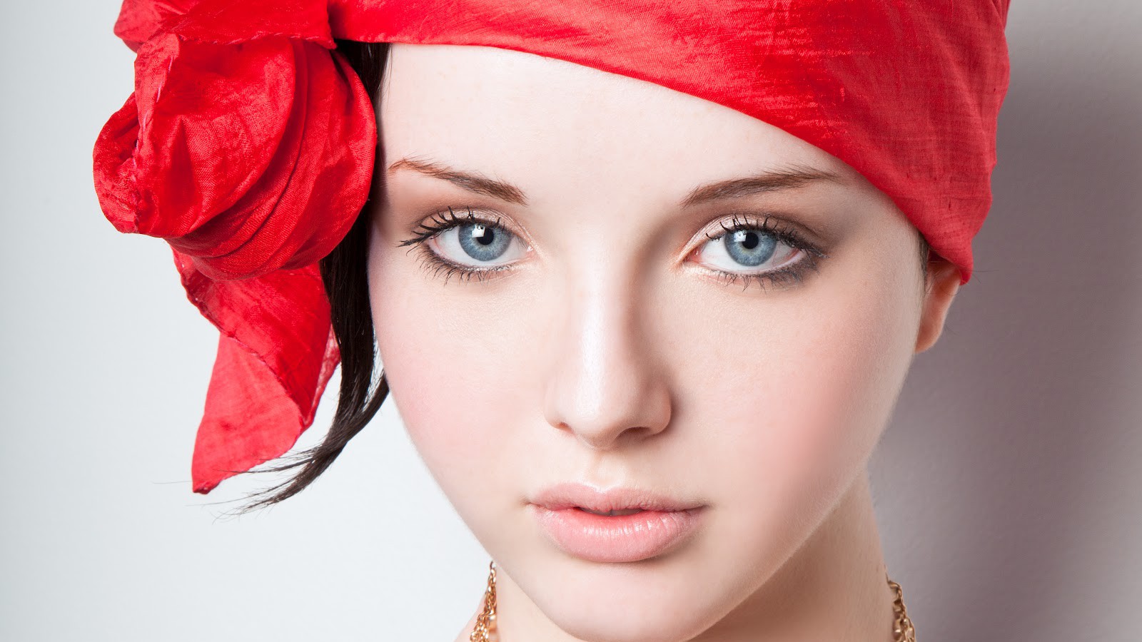 Woman with blue eyes and red headscarf HD Wallpaper