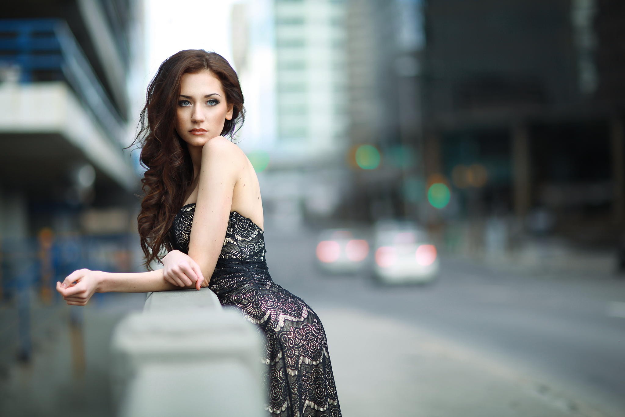 Woman in a black lace dress in a city HD Wallpaper