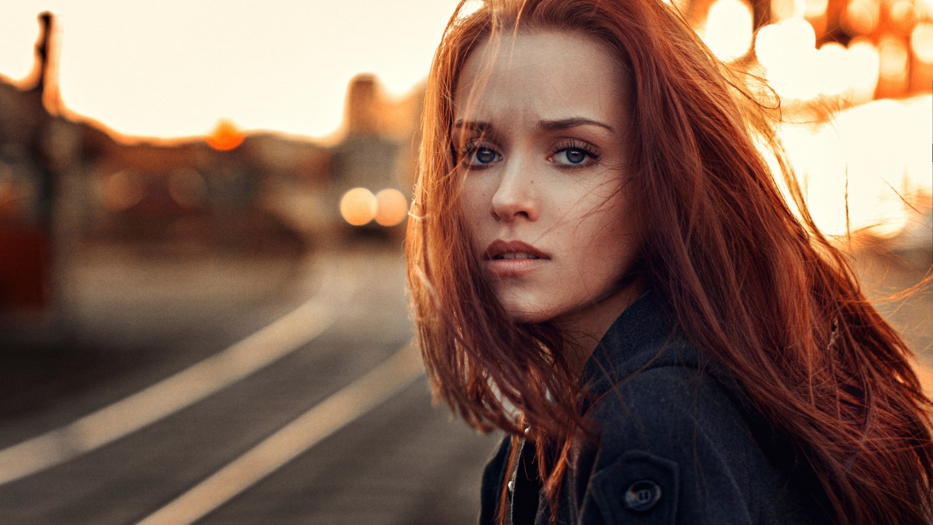 Redhead woman in a black coat outdoors HD Wallpaper