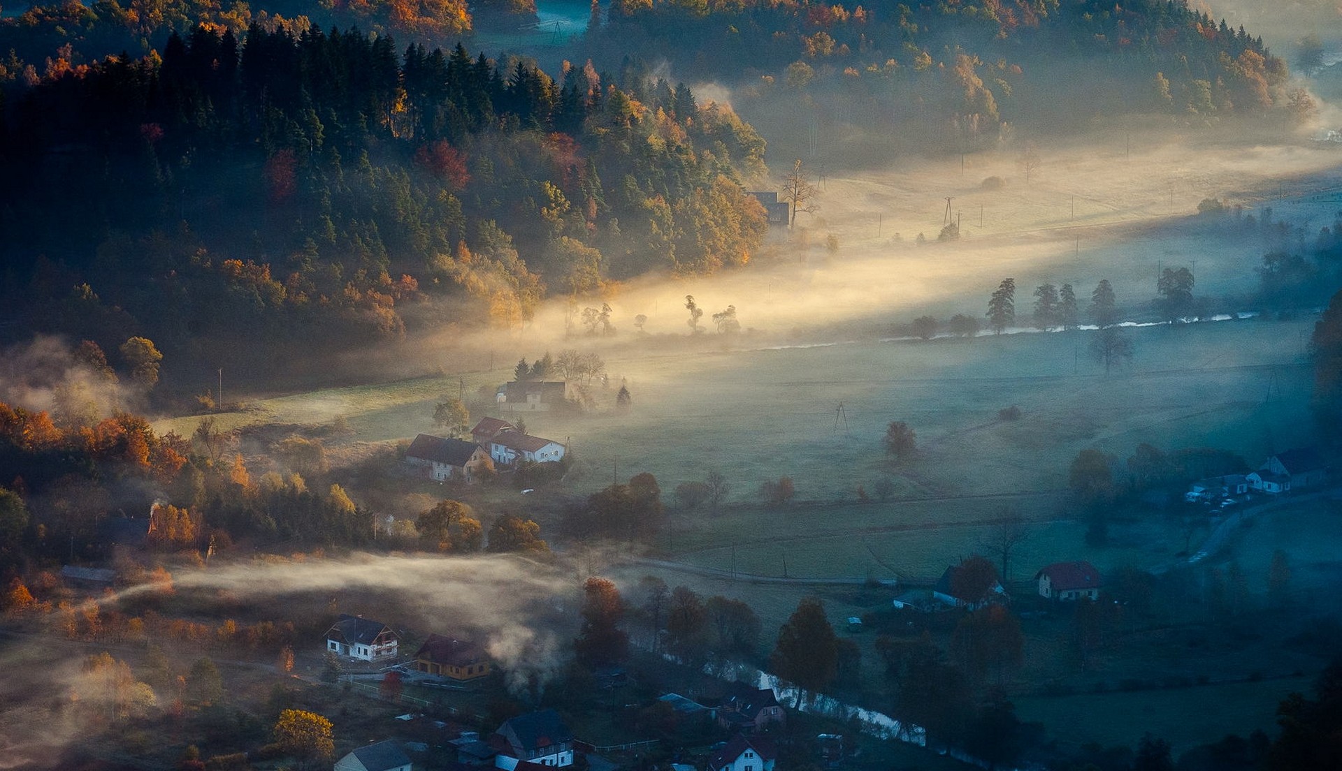 Misty autumn morning over a village and forest HD Wallpaper