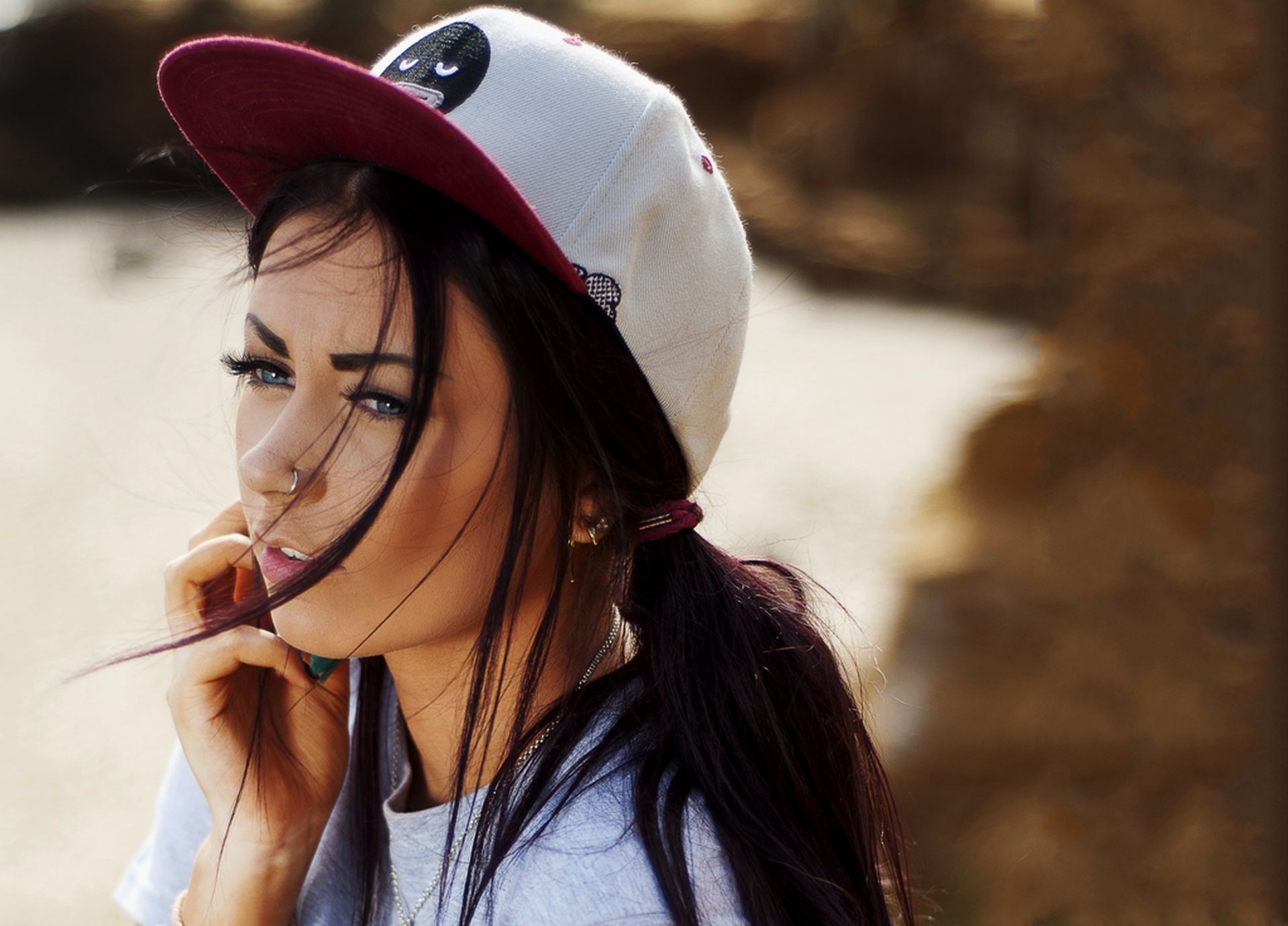 Woman with blue eyes wearing a baseball cap HD Wallpaper