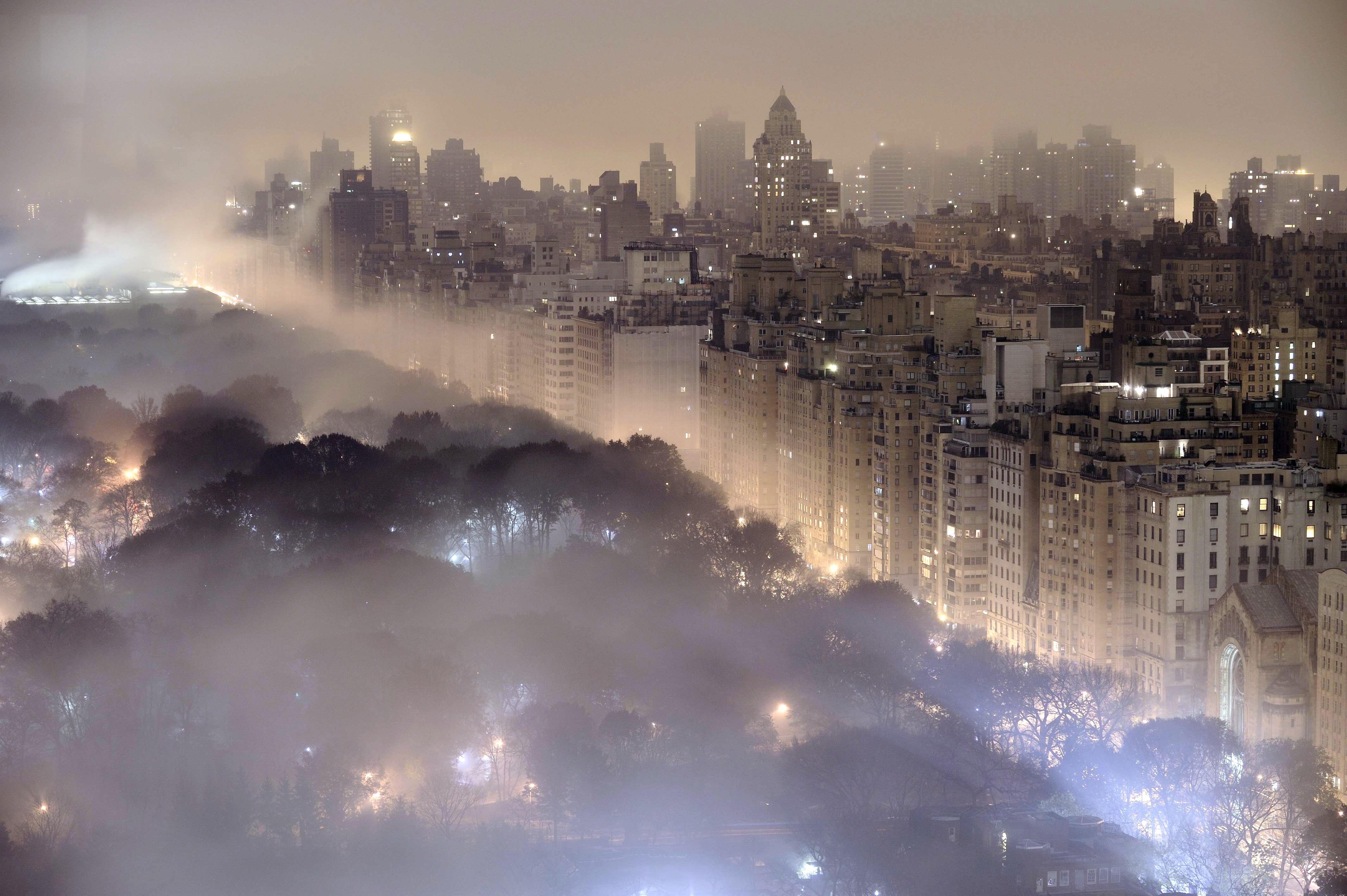 New York City skyline shrouded in mist at night HD Wallpaper