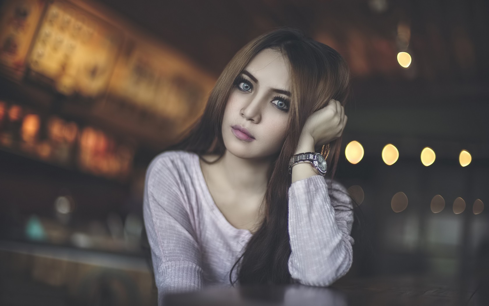 Asian woman with blue eyes wearing a pink sweater HD Wallpaper