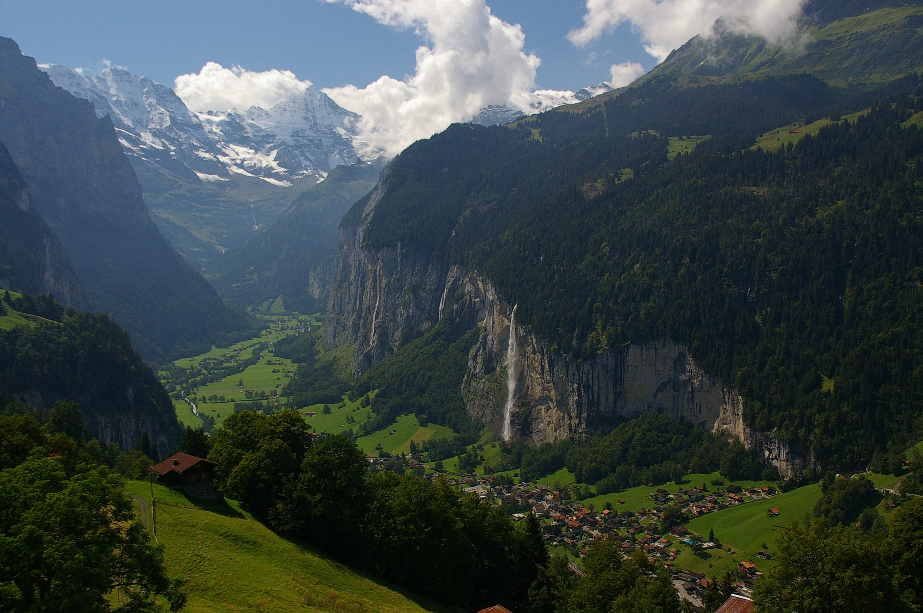Lauterbrunnen Valley with waterfalls and snow-capped mountains HD Wallpaper