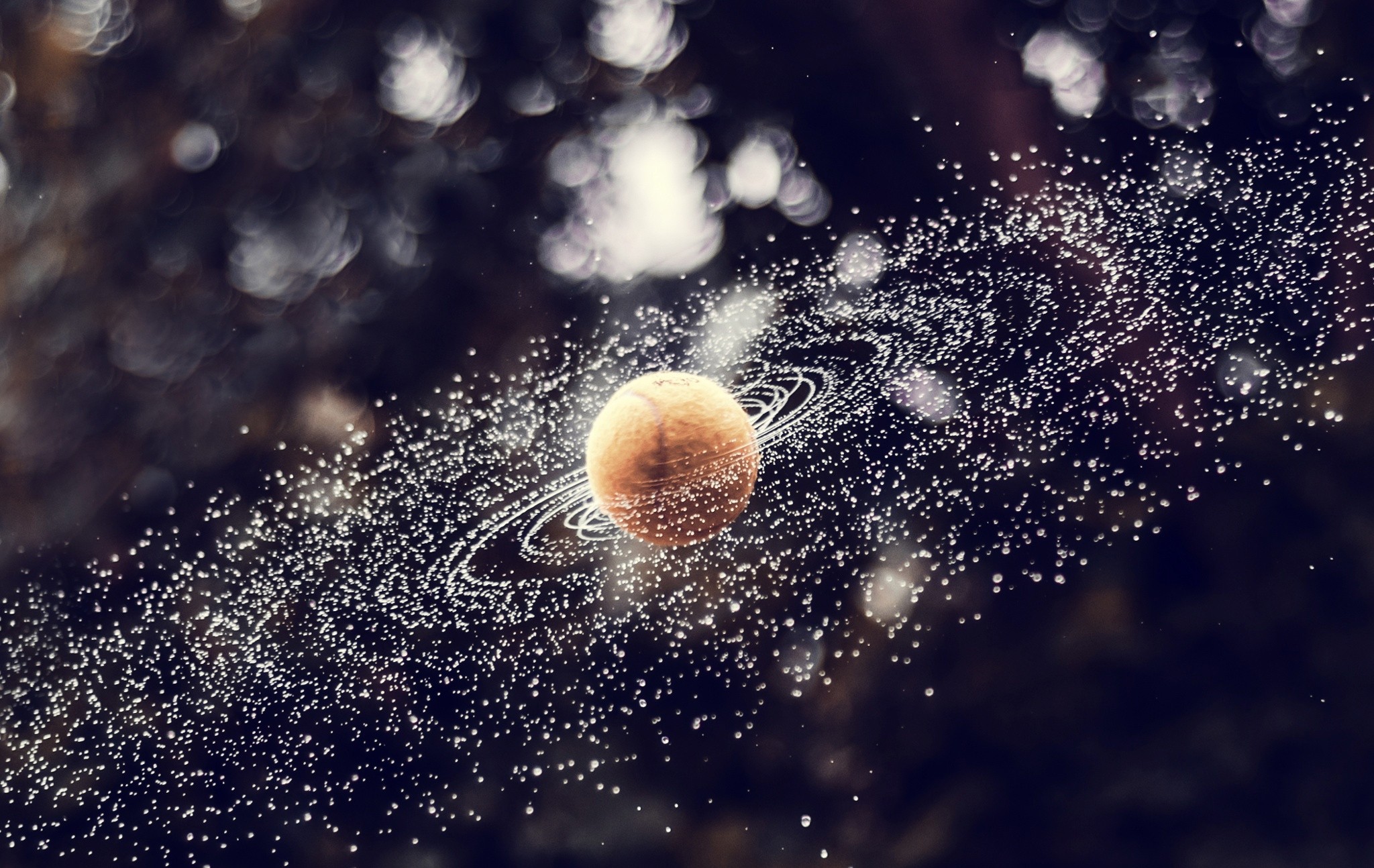 Planet with rings and orbiting particles HD Wallpaper