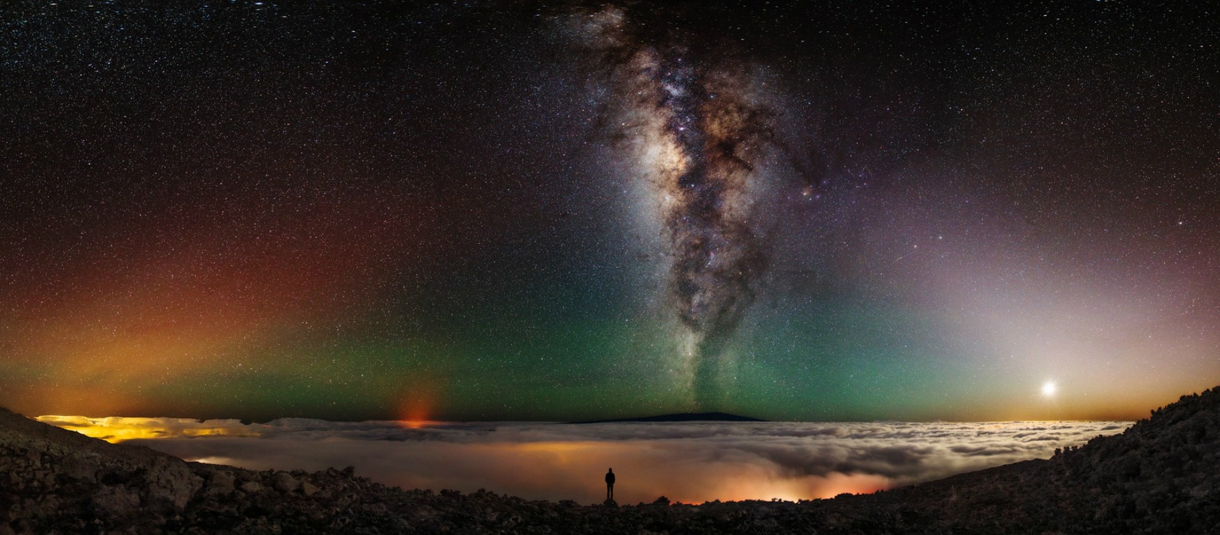 Milky Way over clouds with a lone person HD Wallpaper