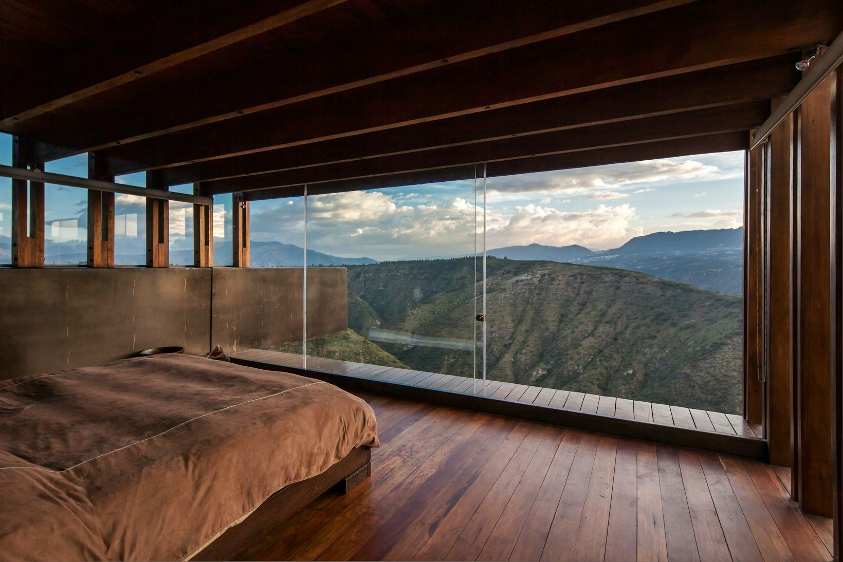 Bedroom with a view of mountains and clouds HD Wallpaper