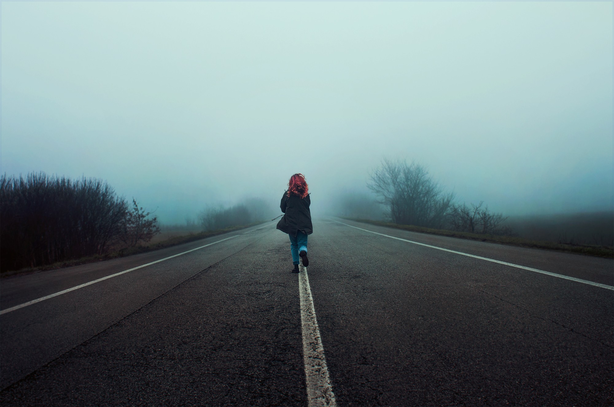 Girl with dyed hair running on a misty road HD Wallpaper