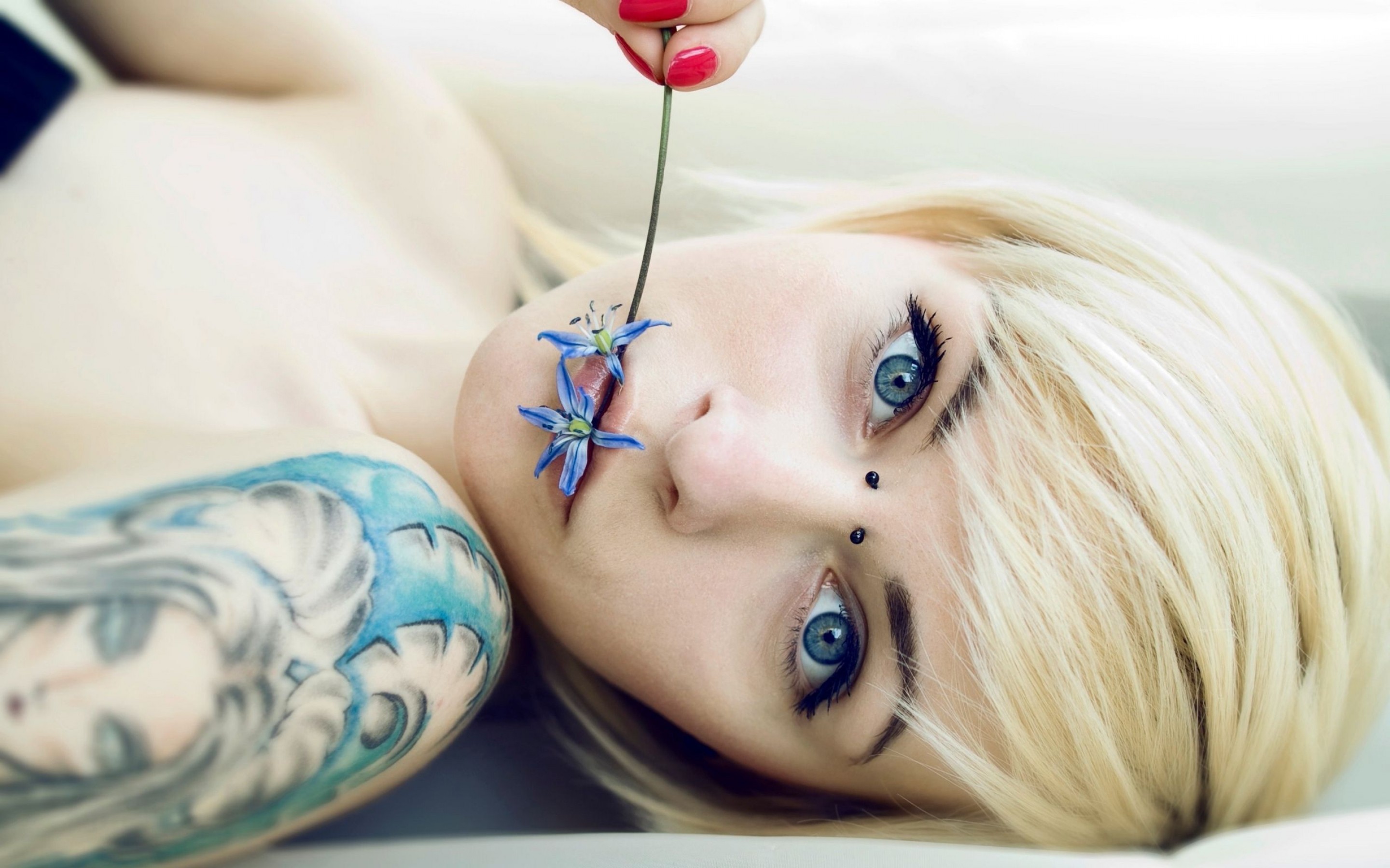 Woman with blonde hair and blue flowers HD Wallpaper