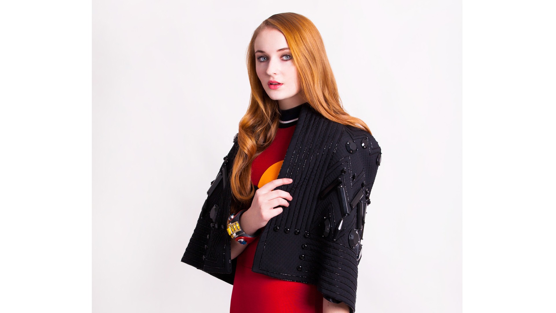 Sophie Turner in a red dress and black jacket HD Wallpaper