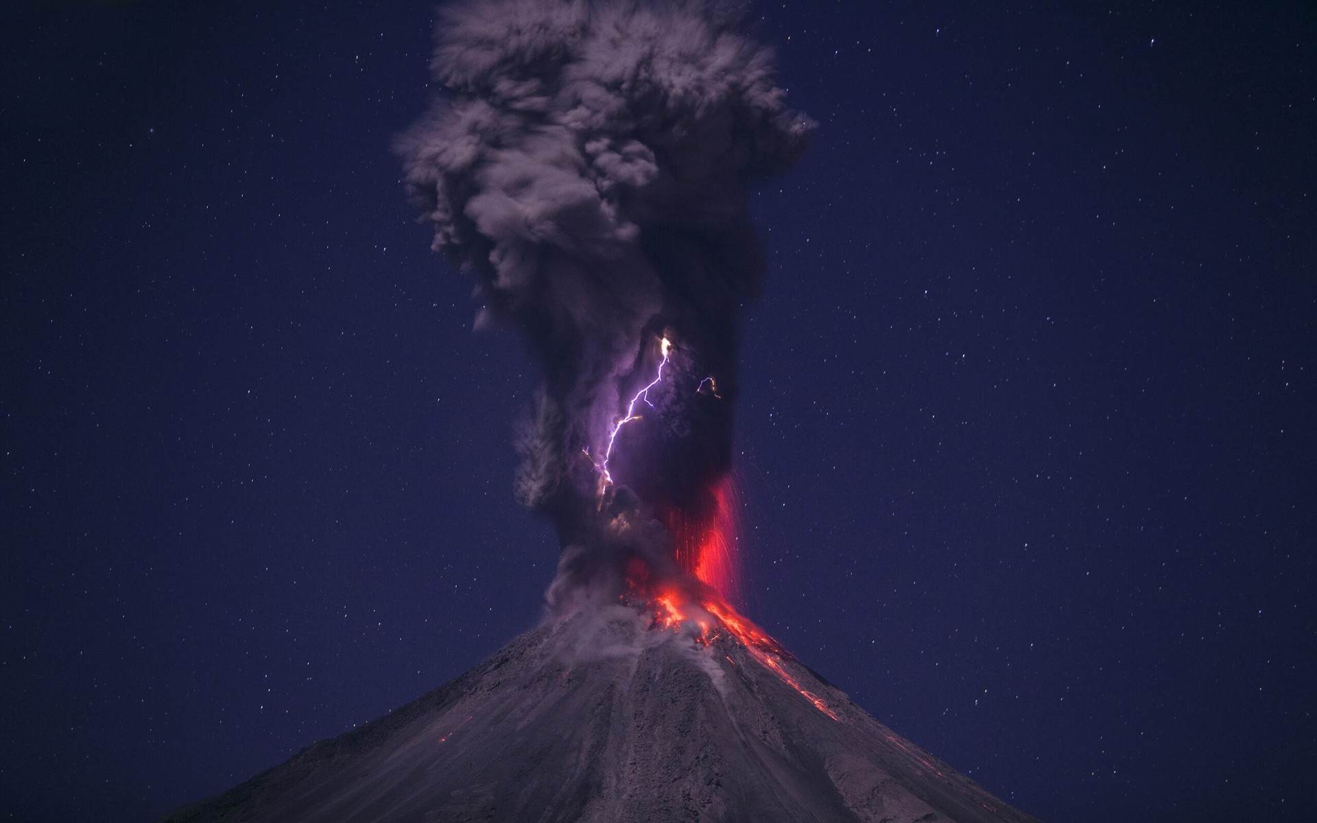 Volcano erupting with lightning at night HD Wallpaper