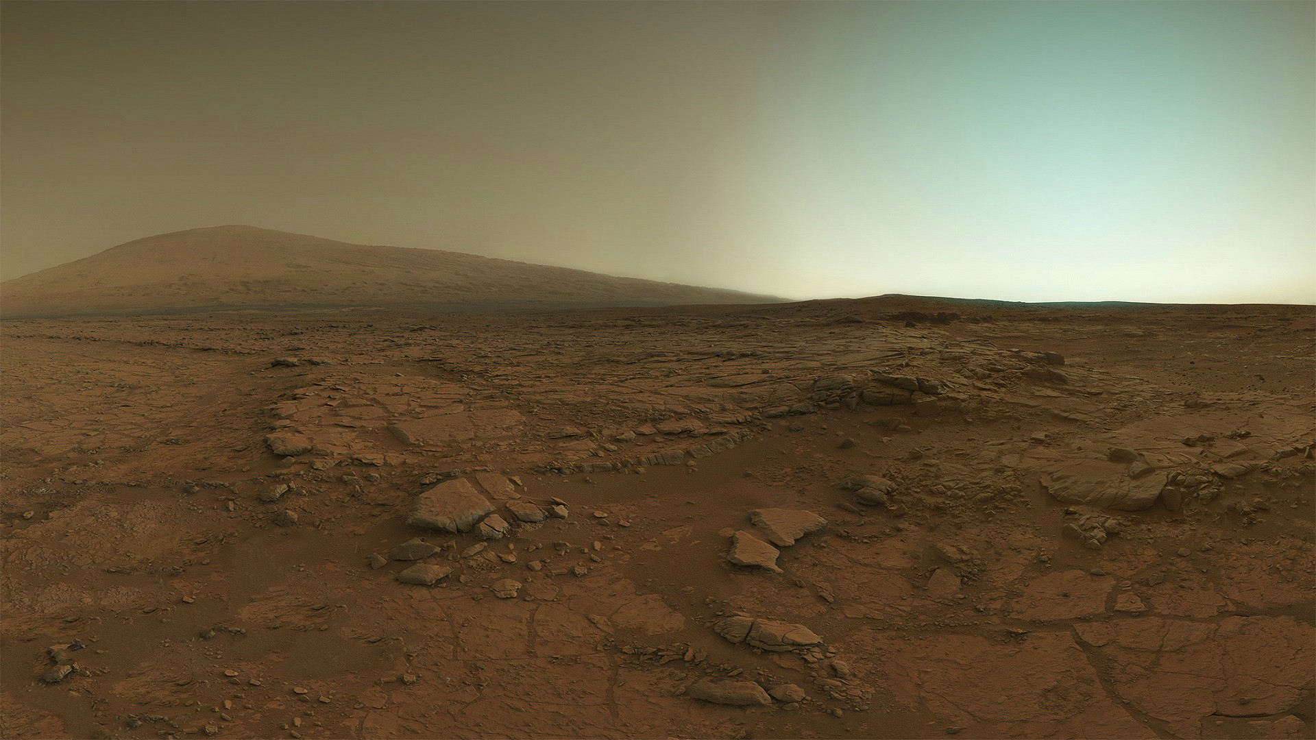 Mars landscape with a distant mountain and dusty sky HD Wallpaper
