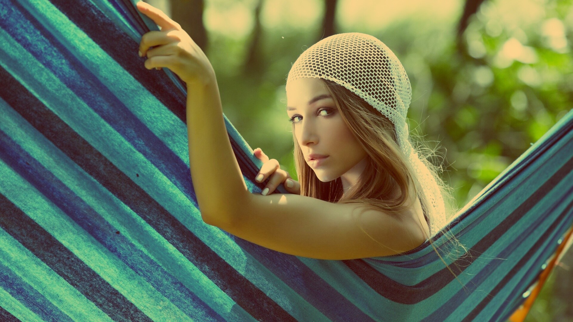 Woman in a hammock wearing a headscarf HD Wallpaper