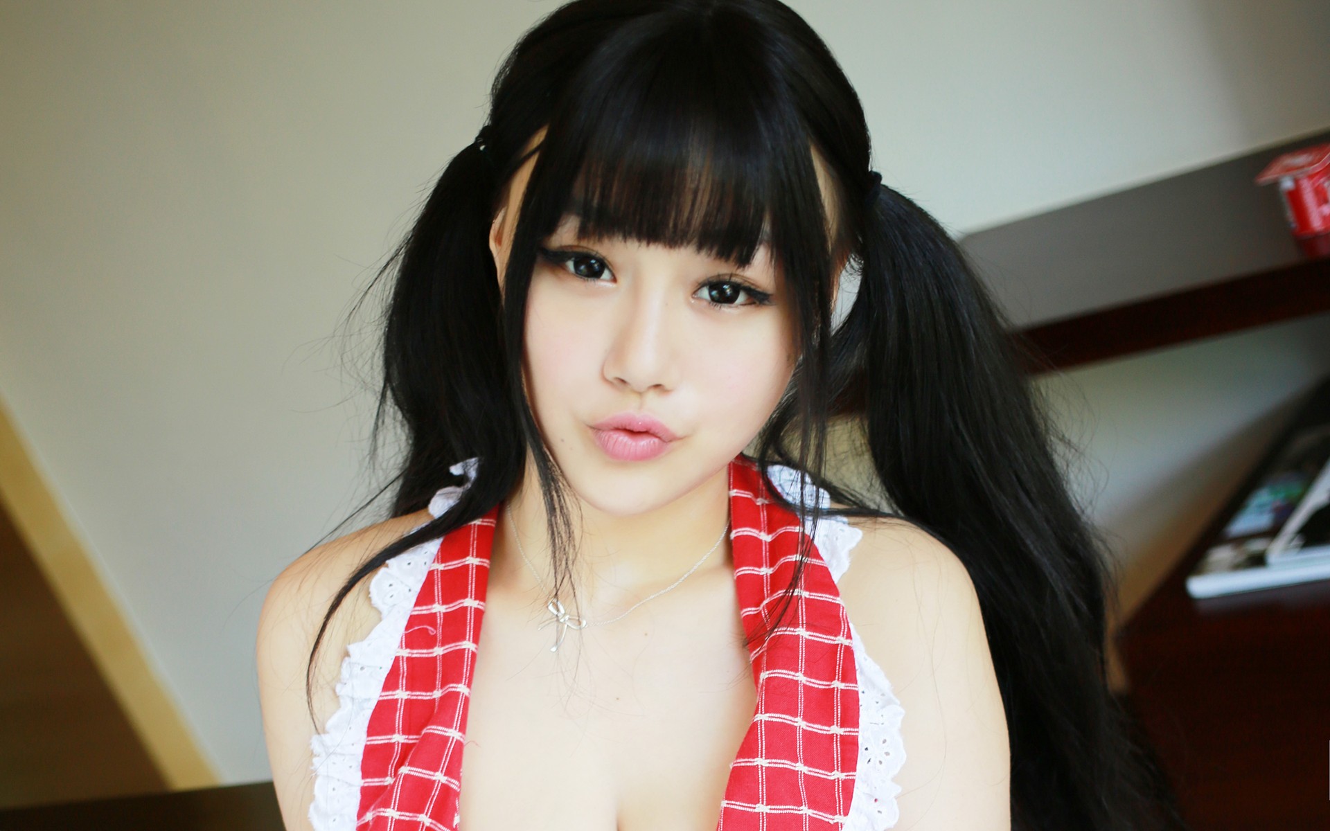 Asian woman with pigtails wearing a red and white apron HD Wallpaper