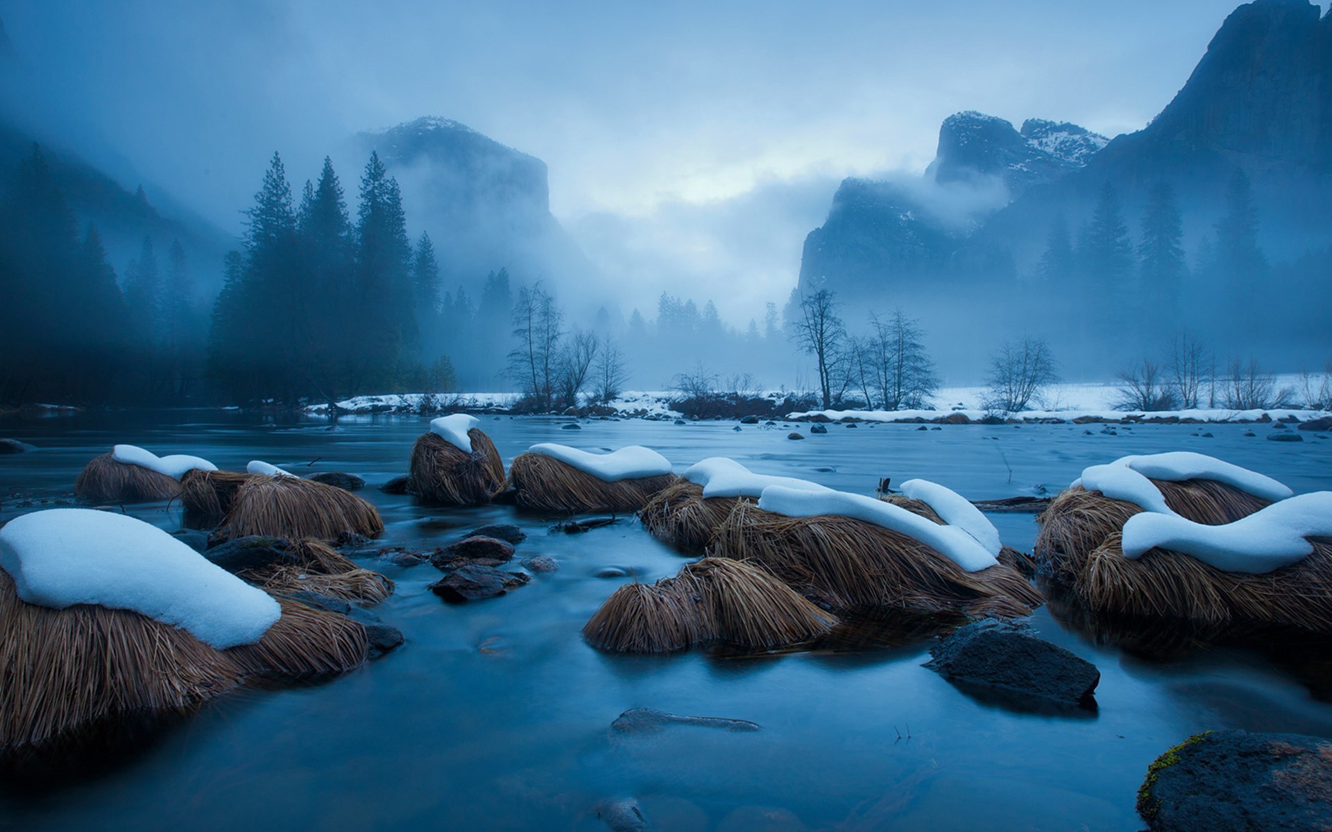 Misty mountains and river with snow-covered rocks HD Wallpaper