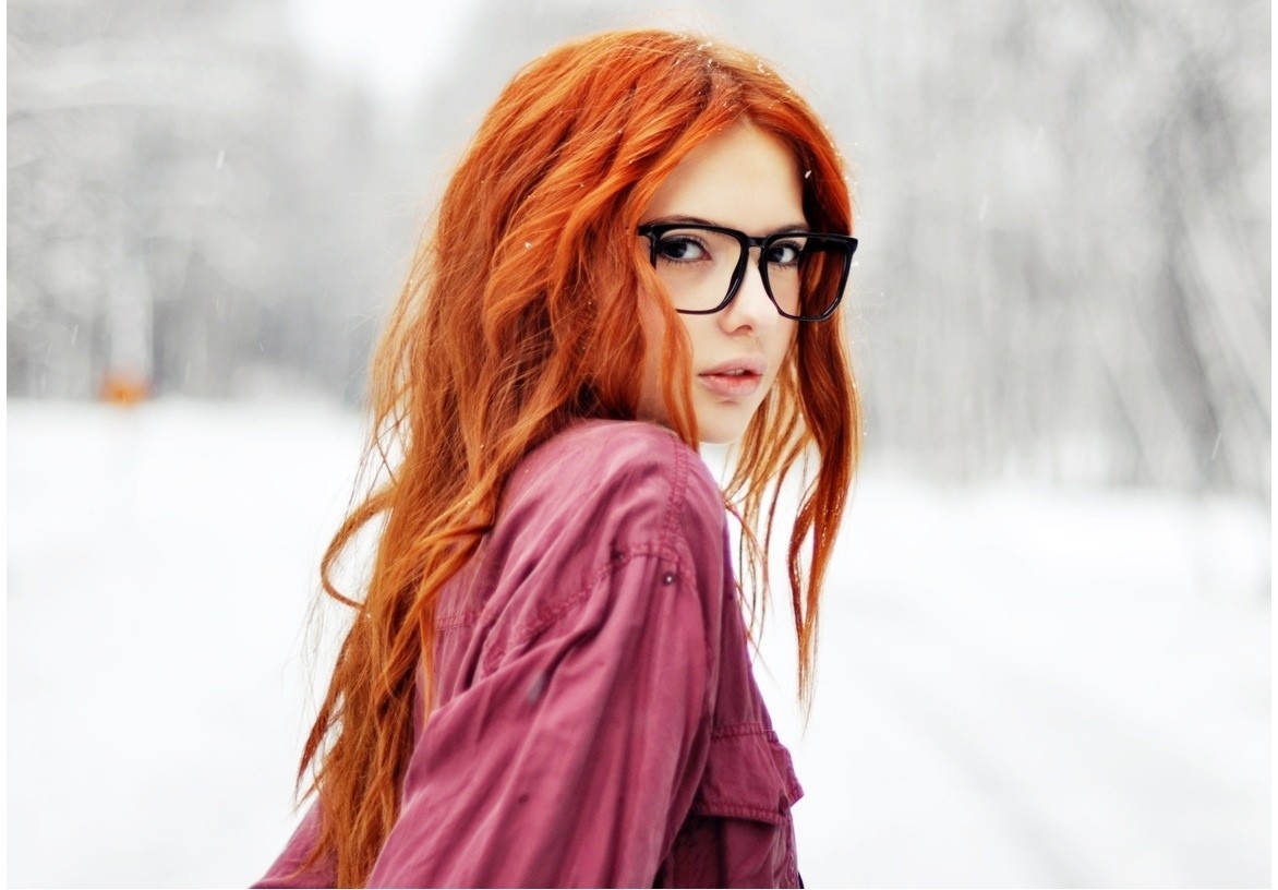 Redhead woman with glasses in the snow HD Wallpaper