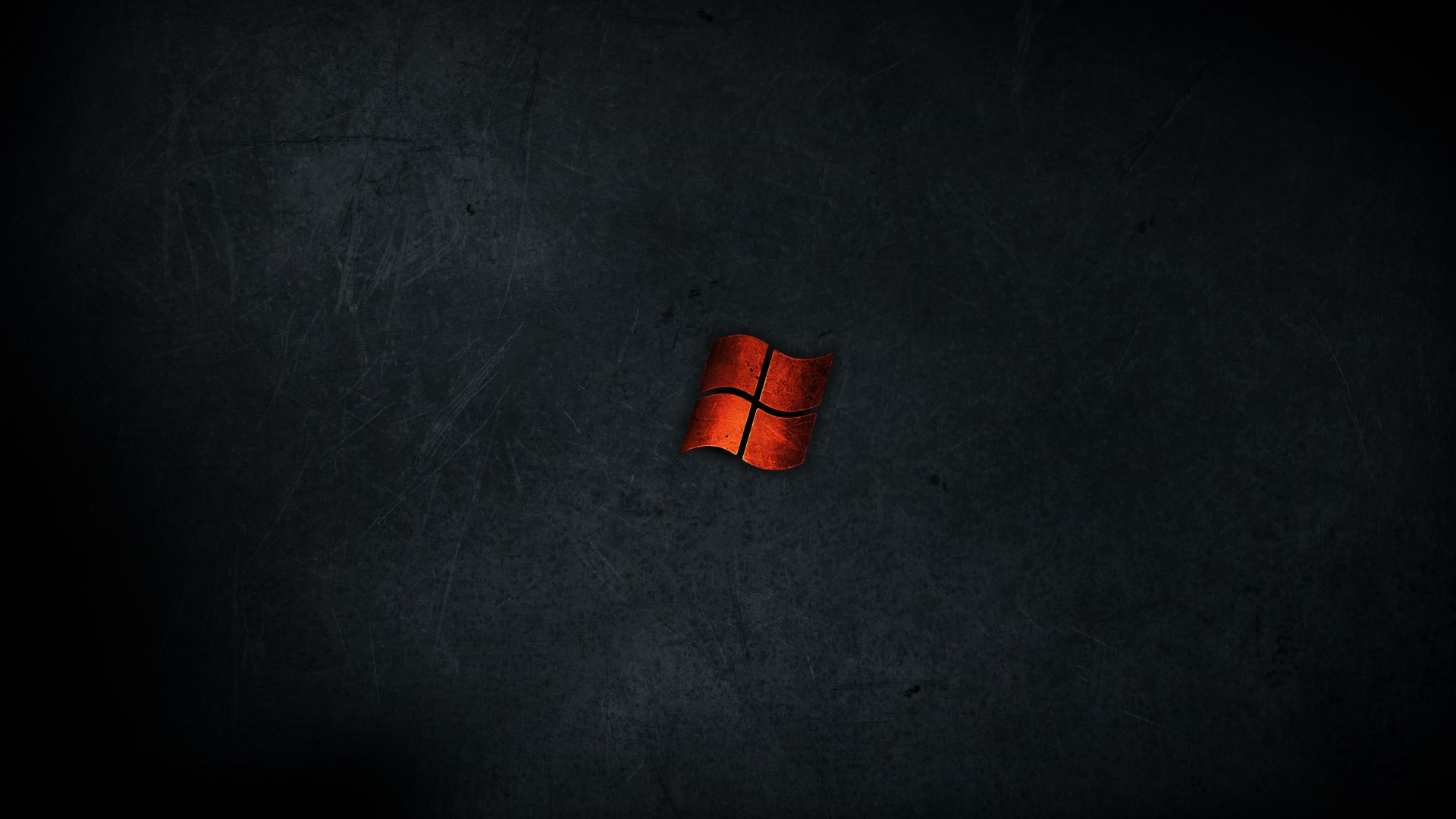Microsoft Windows logo on a dark textured surface HD Wallpaper