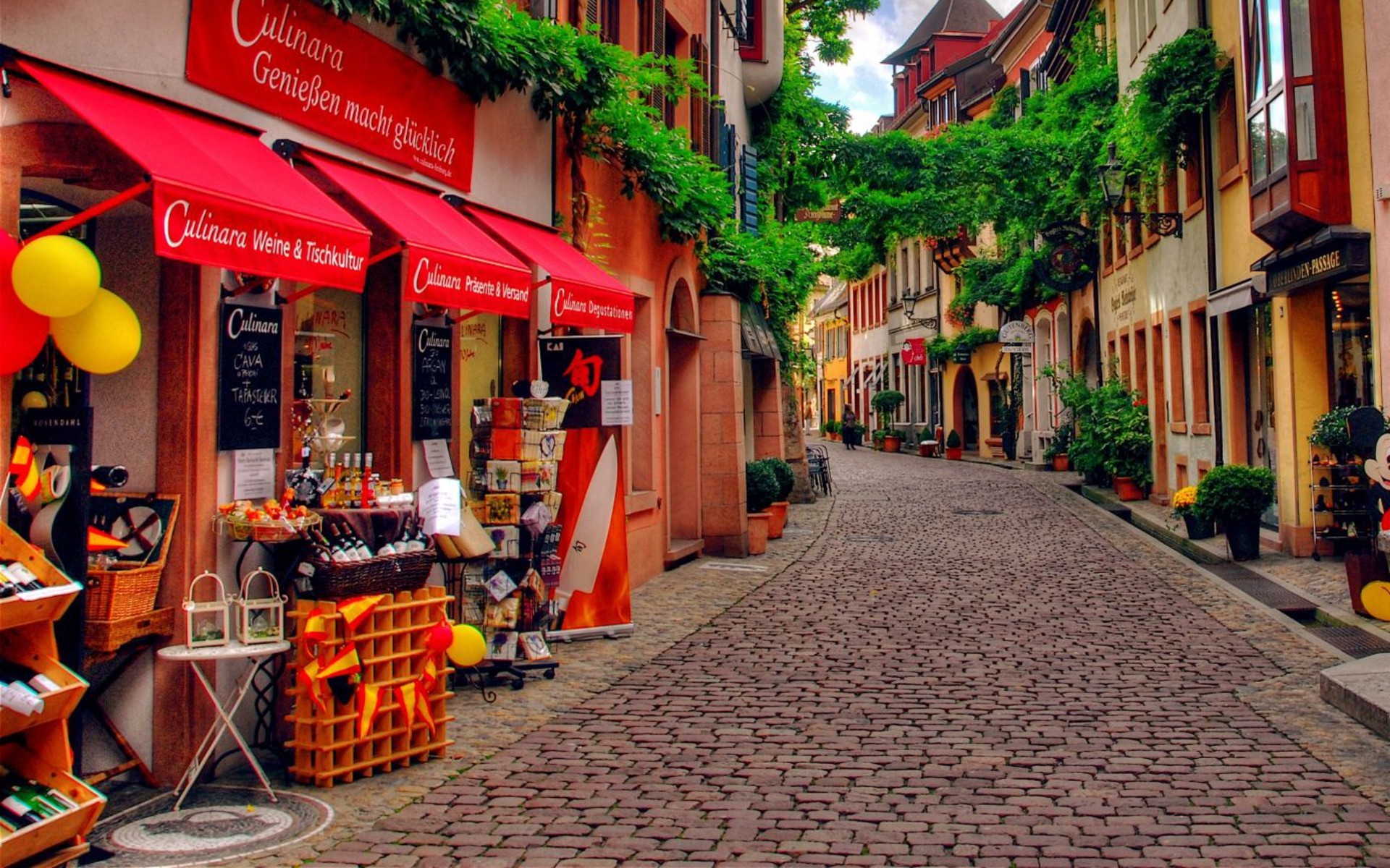 Cobblestone street with shops in Germany HD Wallpaper
