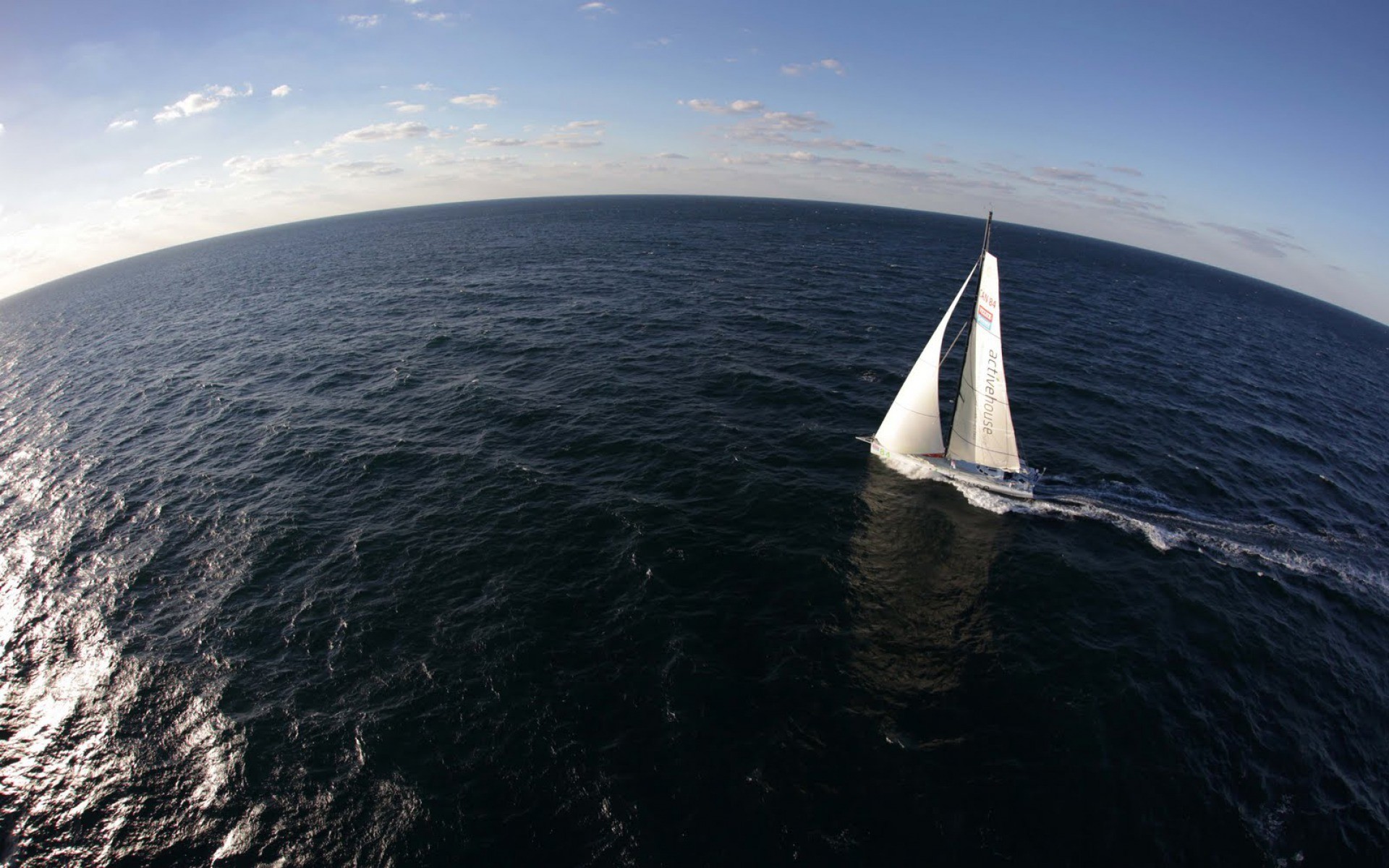Sailboat with white sails on the ocean HD Wallpaper