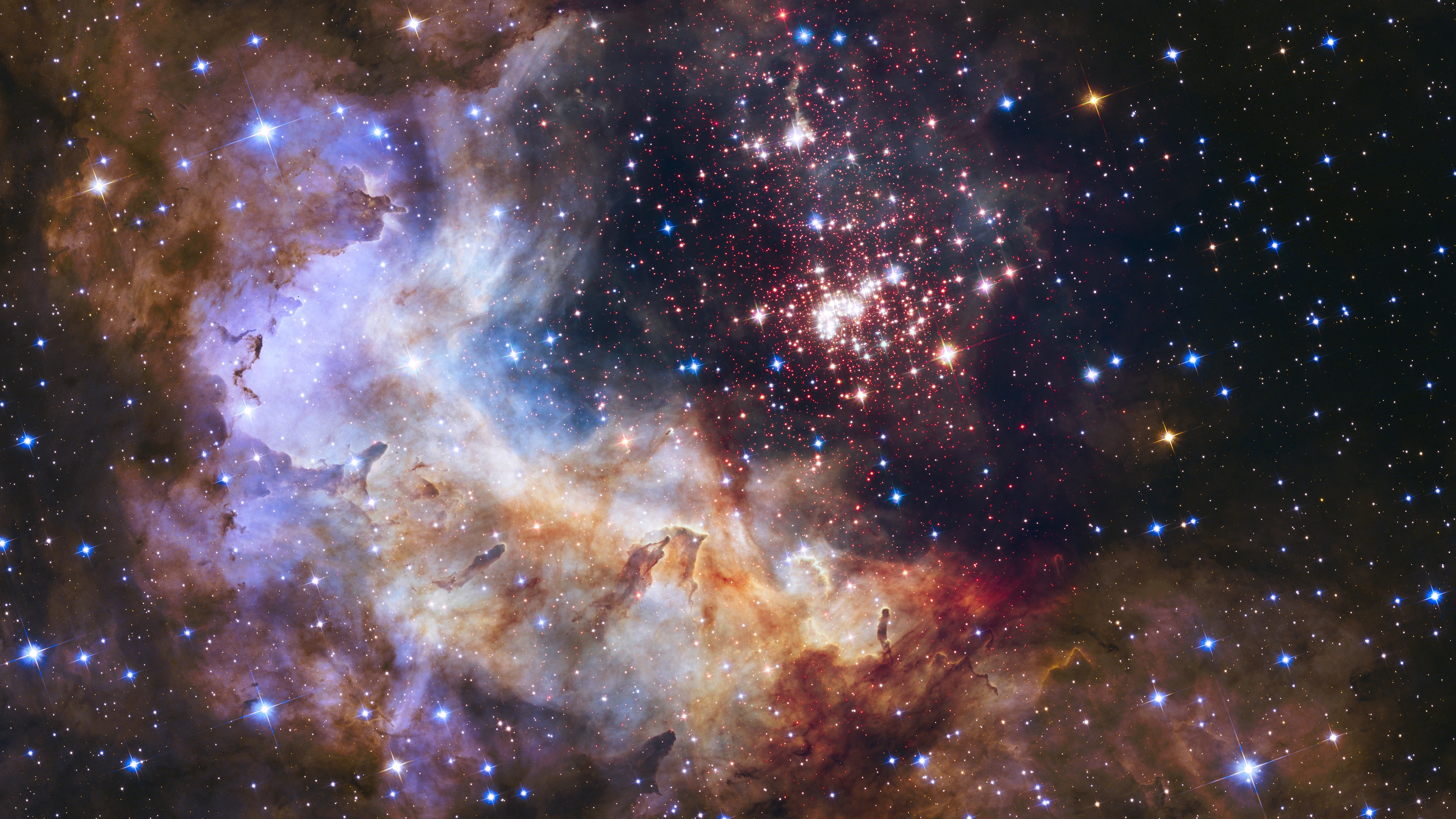 A vibrant nebula with a cluster of stars HD Wallpaper