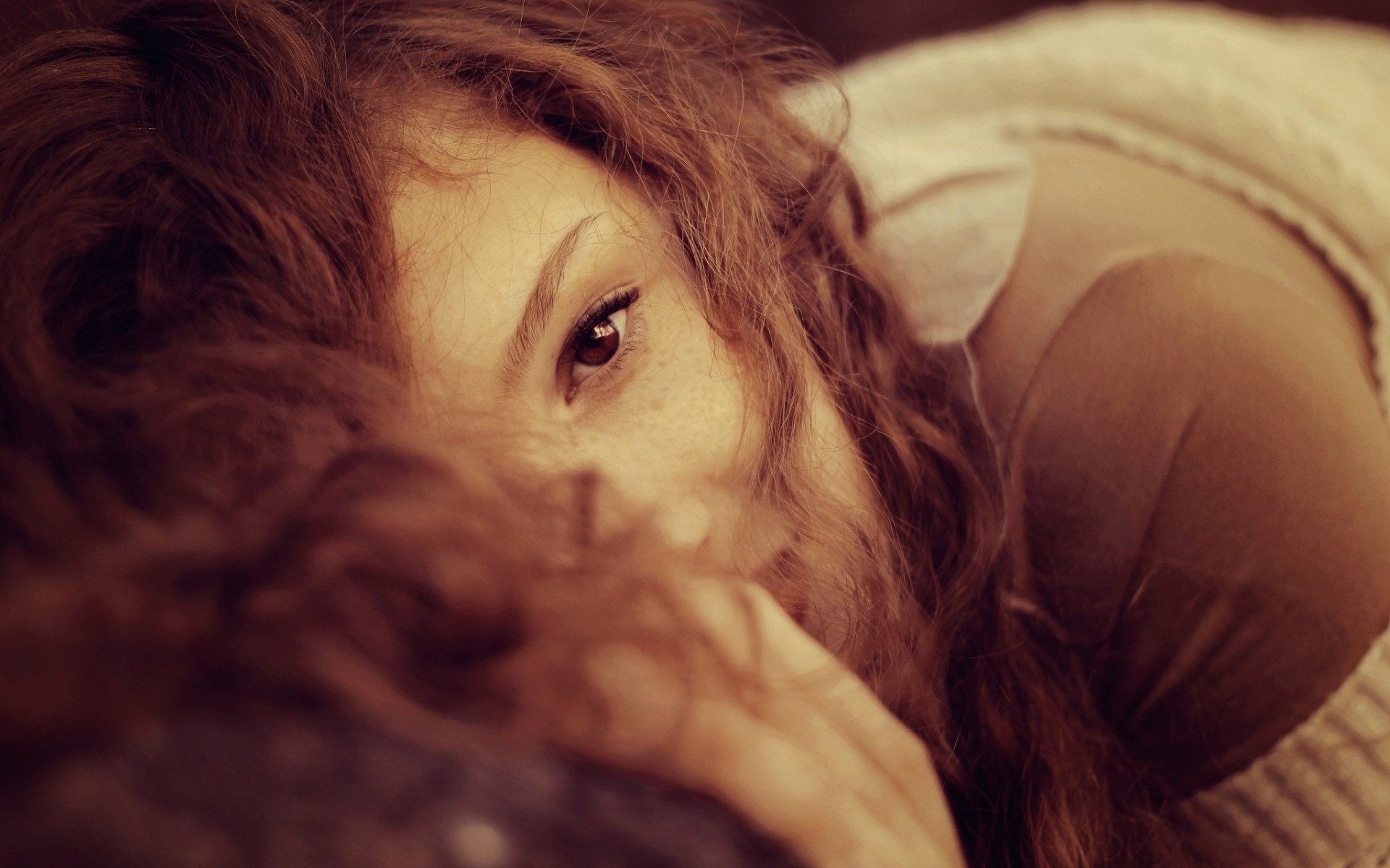 Woman with curly red hair looking at the camera HD Wallpaper