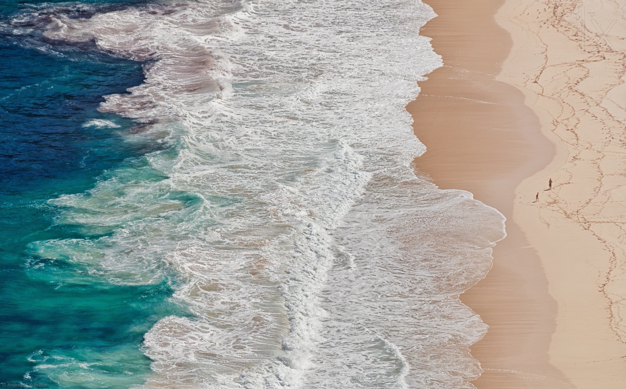Aerial view of waves crashing on a sandy beach in South Africa HD Wallpaper