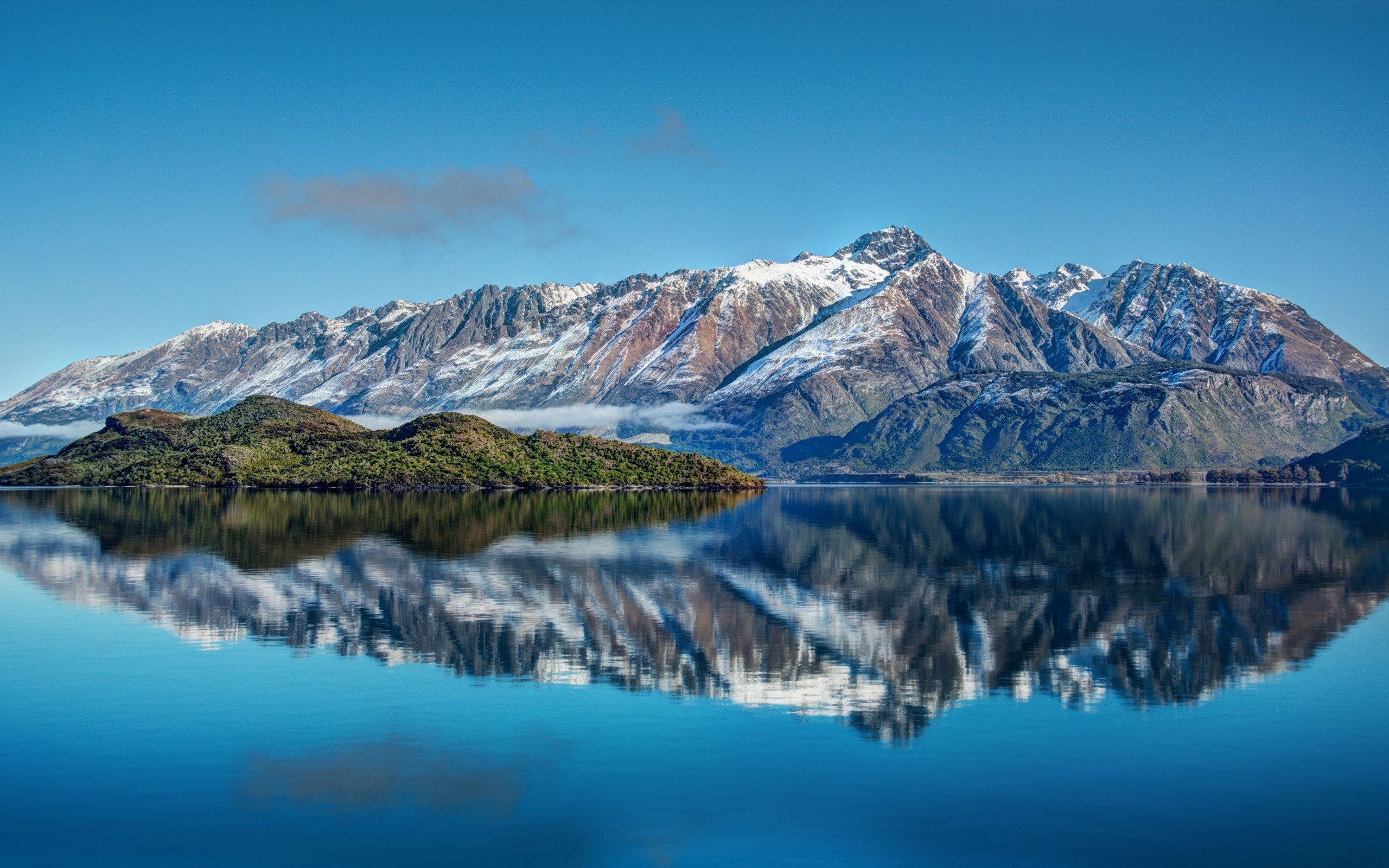 Snow-capped mountains reflected in a lake in New Zealand HD Wallpaper
