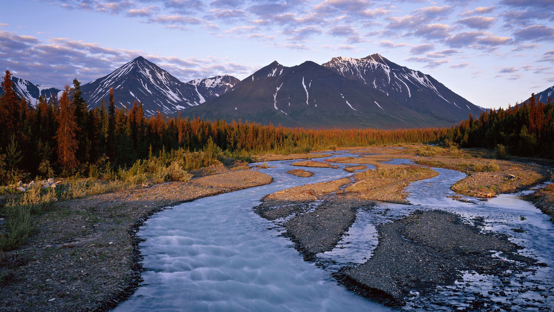 River flowing through a valley with mountains and trees HD Wallpaper