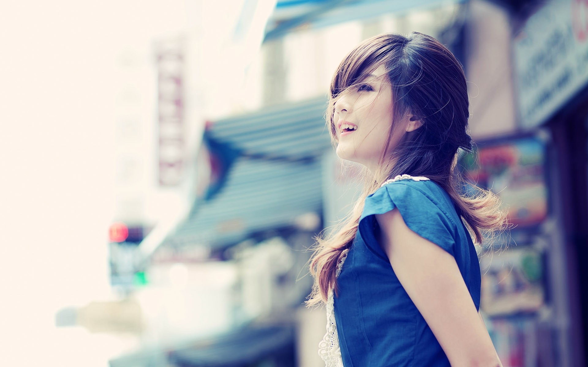 Asian woman in blue dress looking up HD Wallpaper