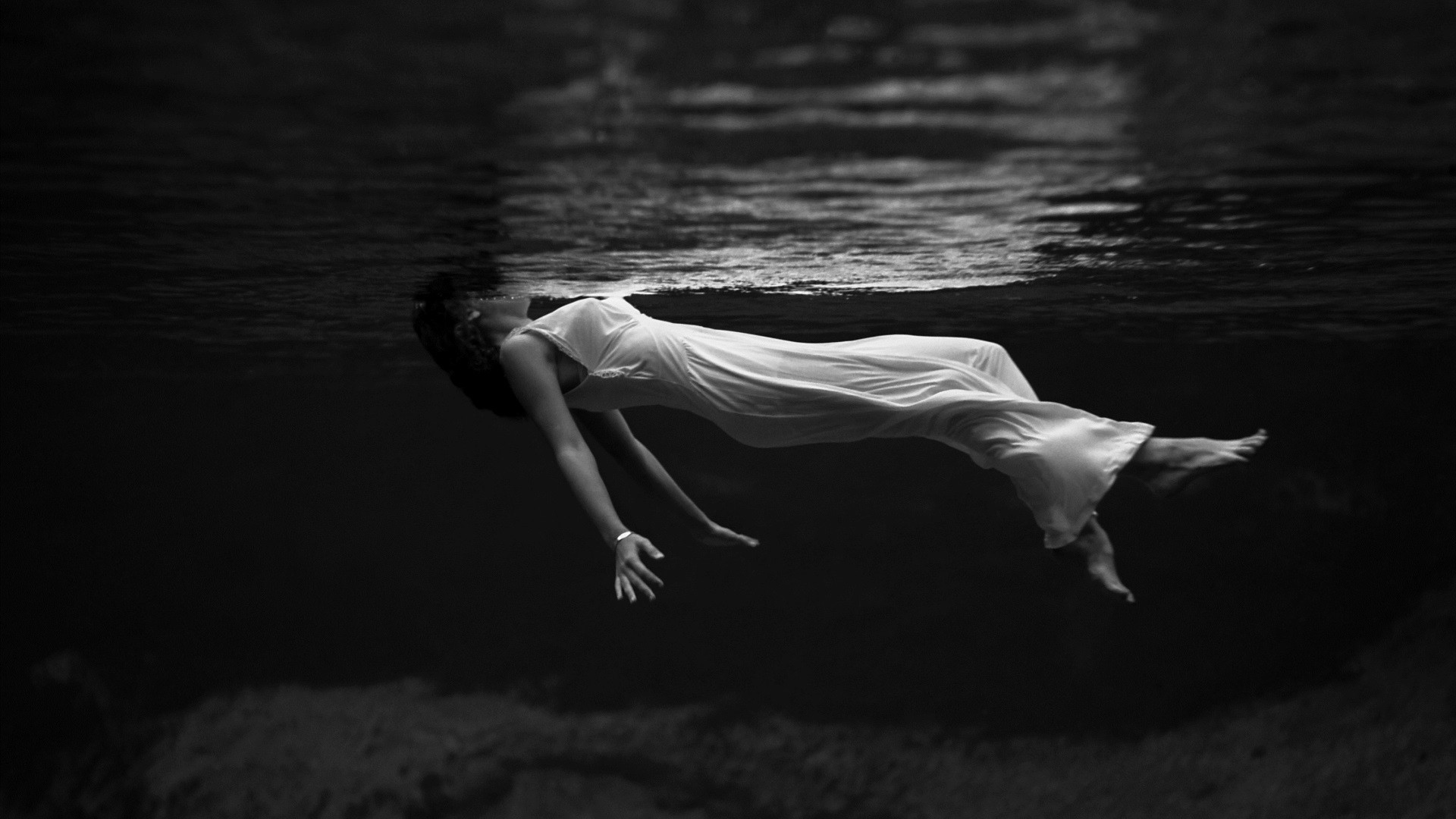 Woman in white dress floating underwater HD Wallpaper