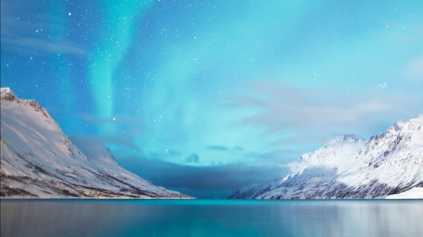 Aurora Borealis over snow-covered mountains and a lake HD Wallpaper