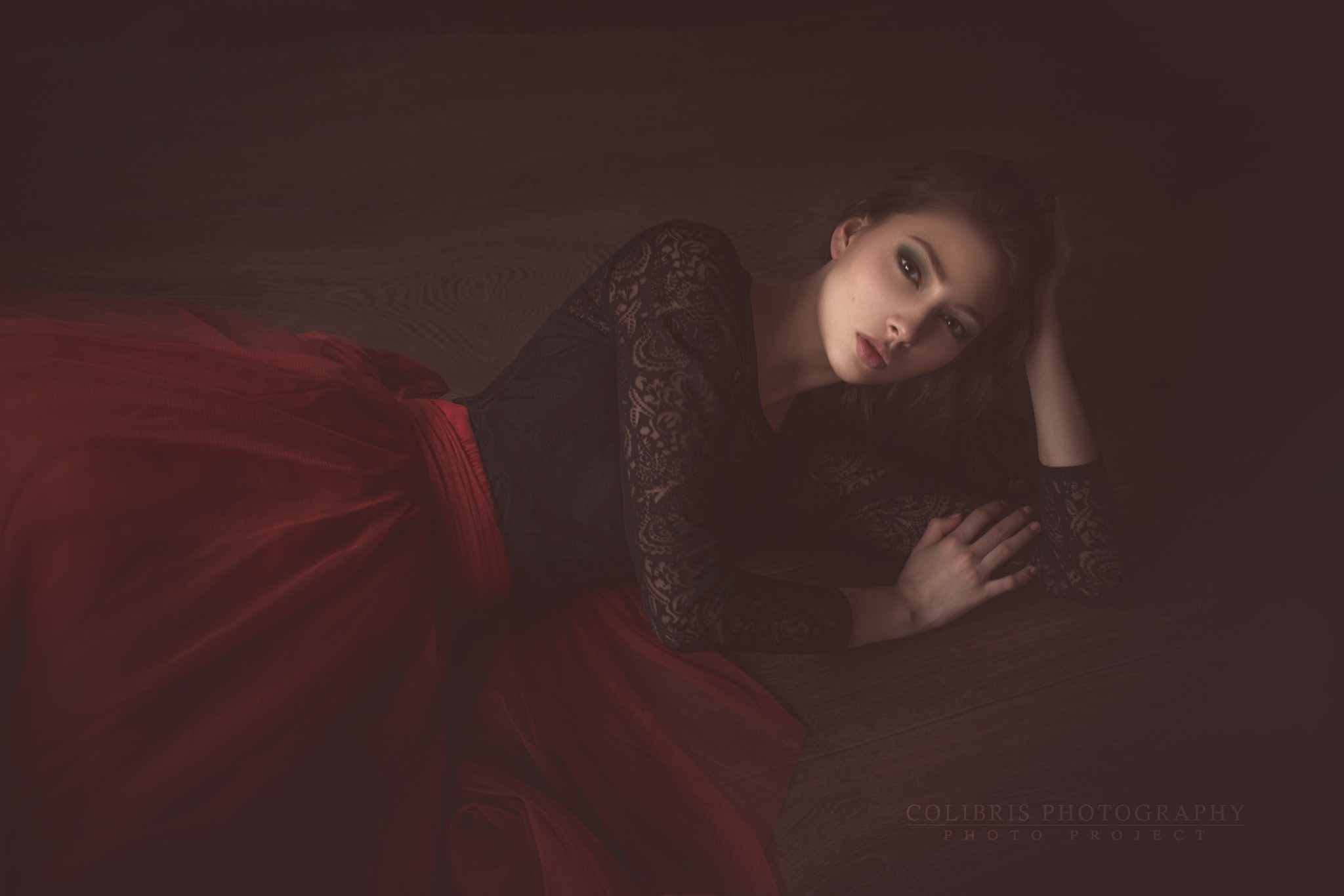 Woman in red dress lying on floor HD Wallpaper