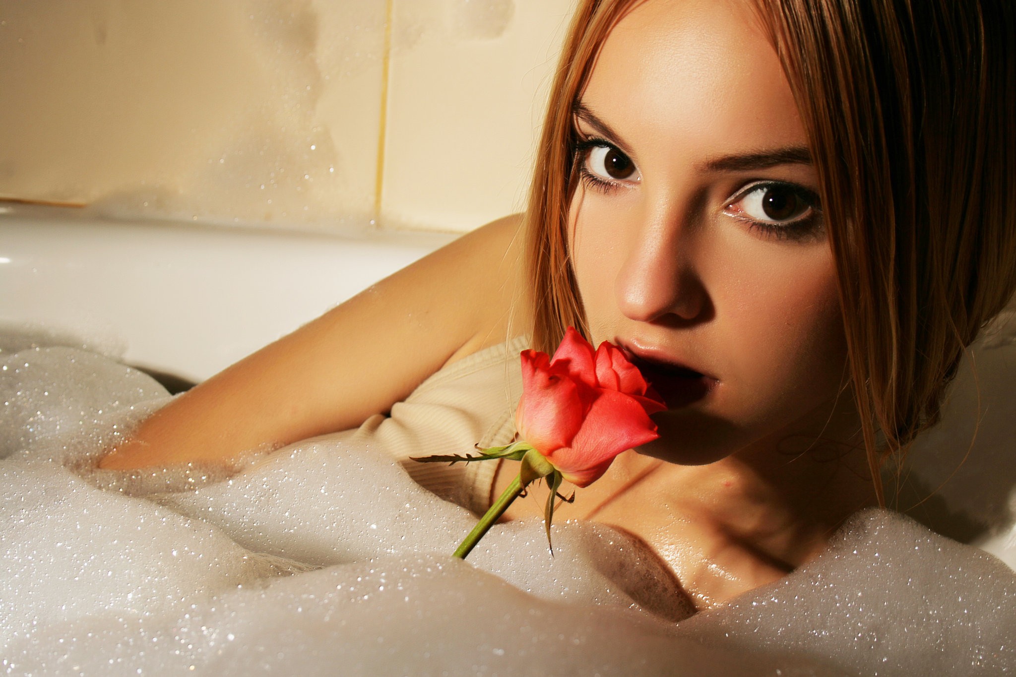 Woman with a rose in a bubble bath HD Wallpaper