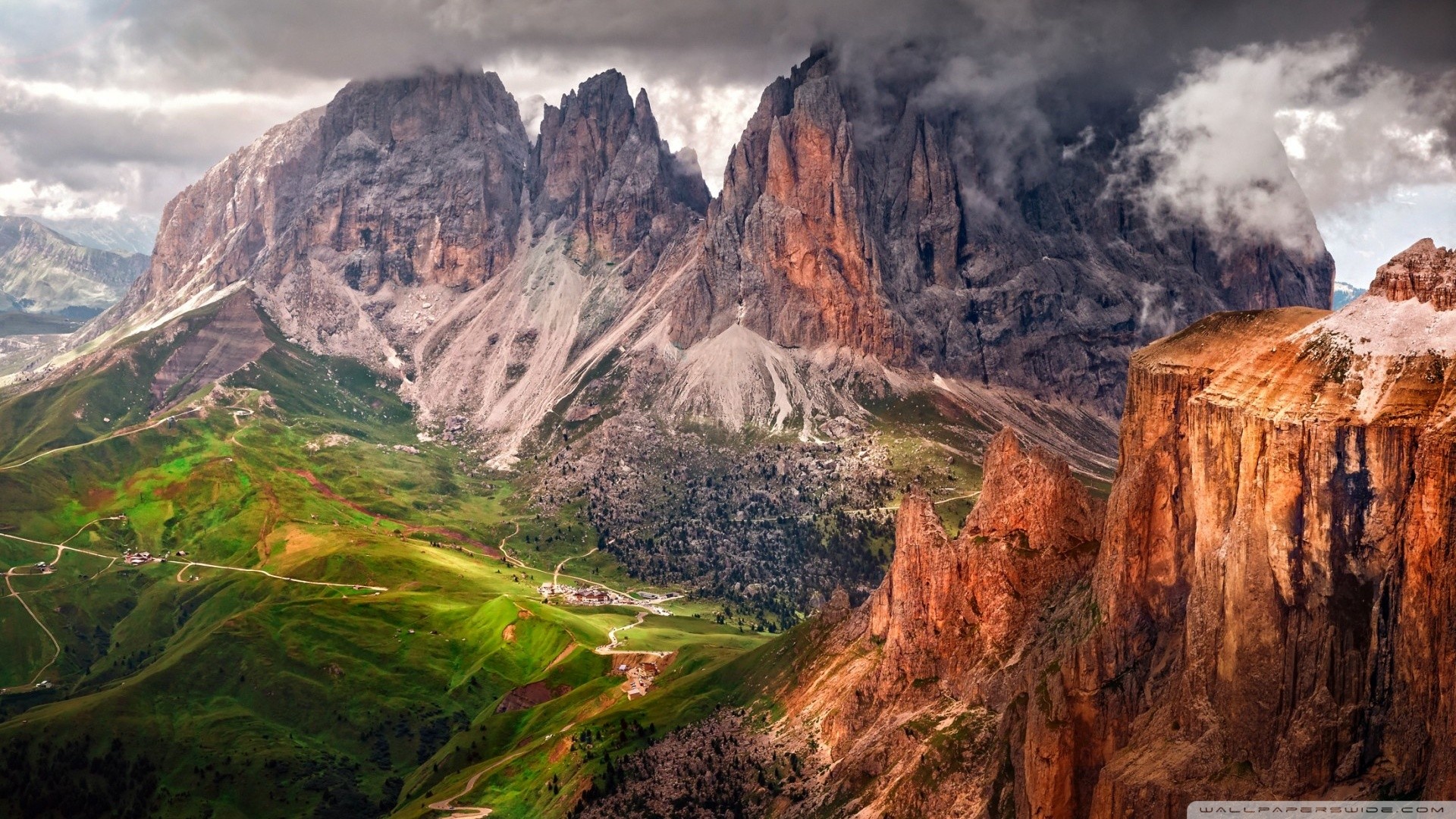 Mountain landscape with green valleys and rocky peaks HD Wallpaper