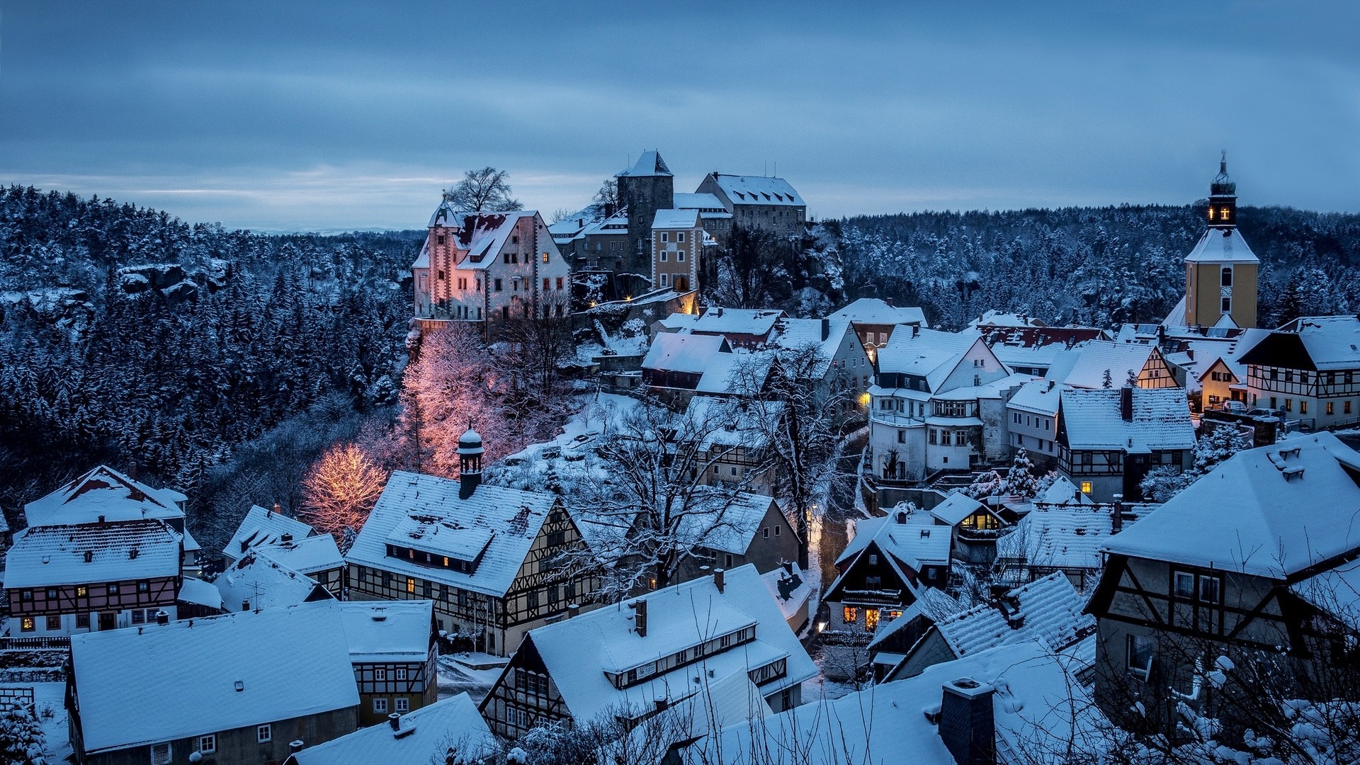 Snow-covered village with a castle and forest HD Wallpaper