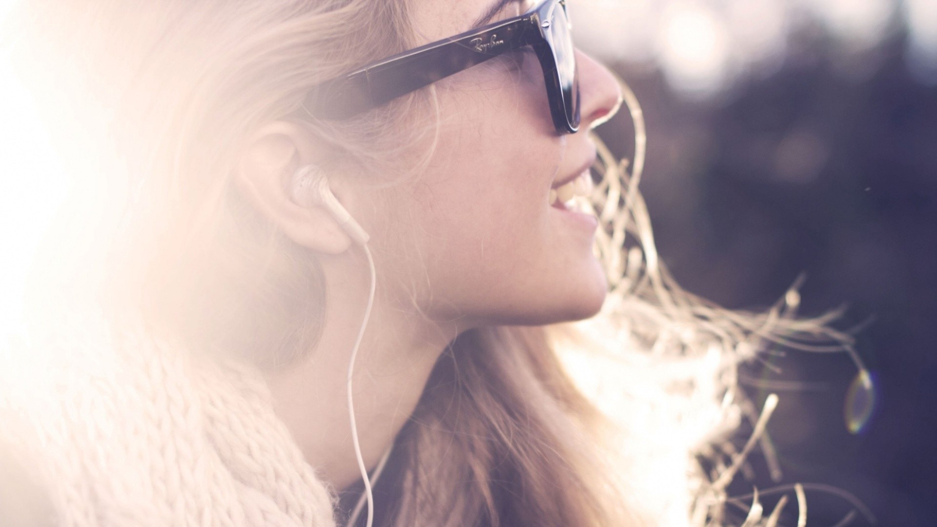 Woman wearing sunglasses and headphones listening to music HD Wallpaper
